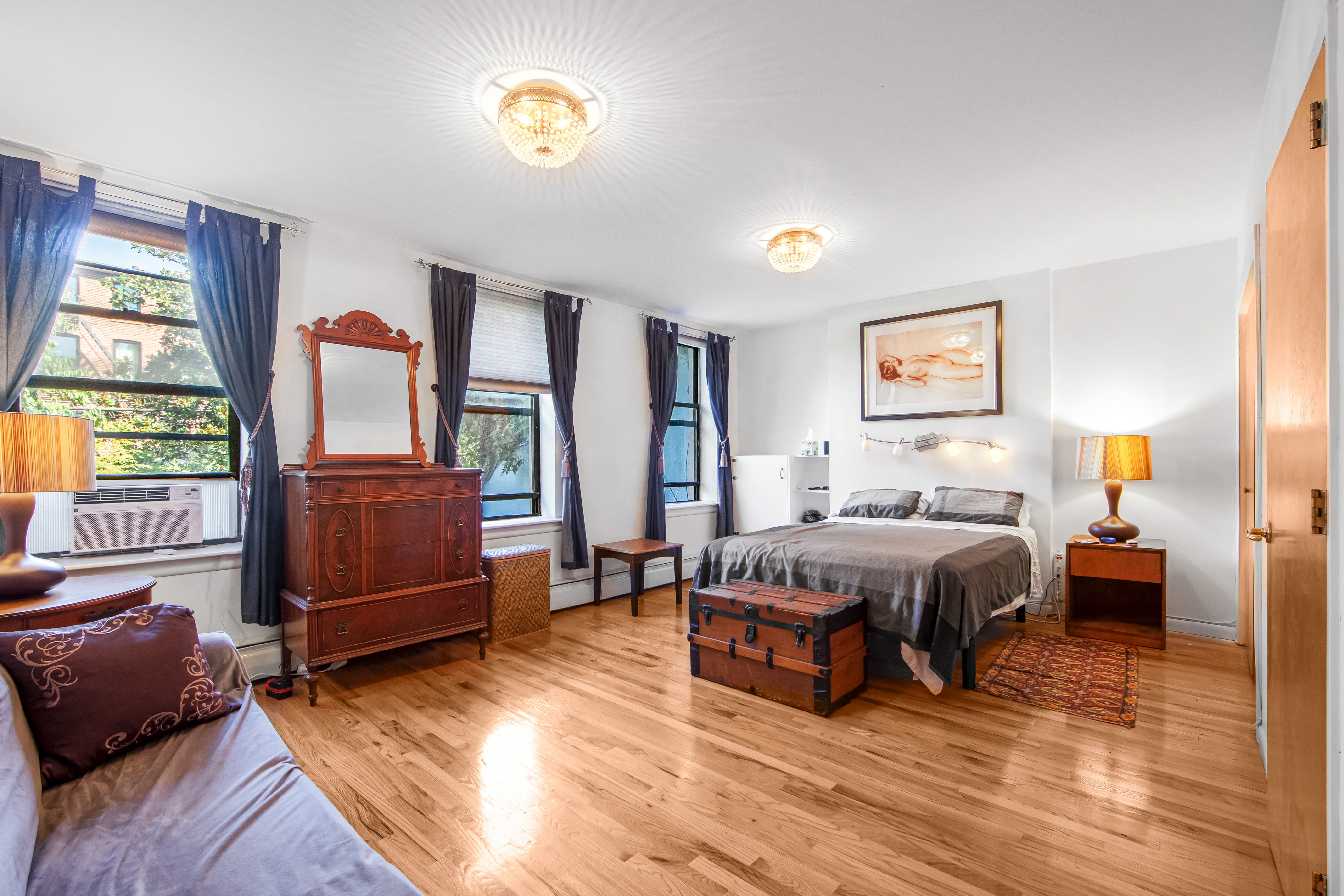 129 Waverly Avenue, Unit 1 Brooklyn, NY 11205 - Photo 7 of 13 a spacious bedroom with a bed and wooden floor