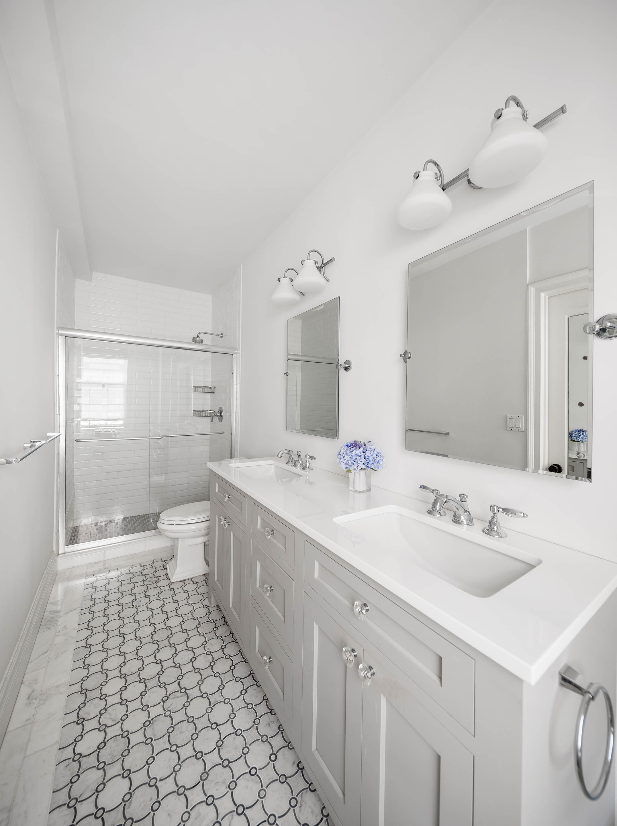 174 West 76th Street, Unit 4GH Manhattan, NY 10023 - Photo 8 of 16 a spacious bathroom with a double vanity sink mirror and toilet