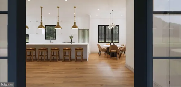 a dining room with furniture and a floor to ceiling window