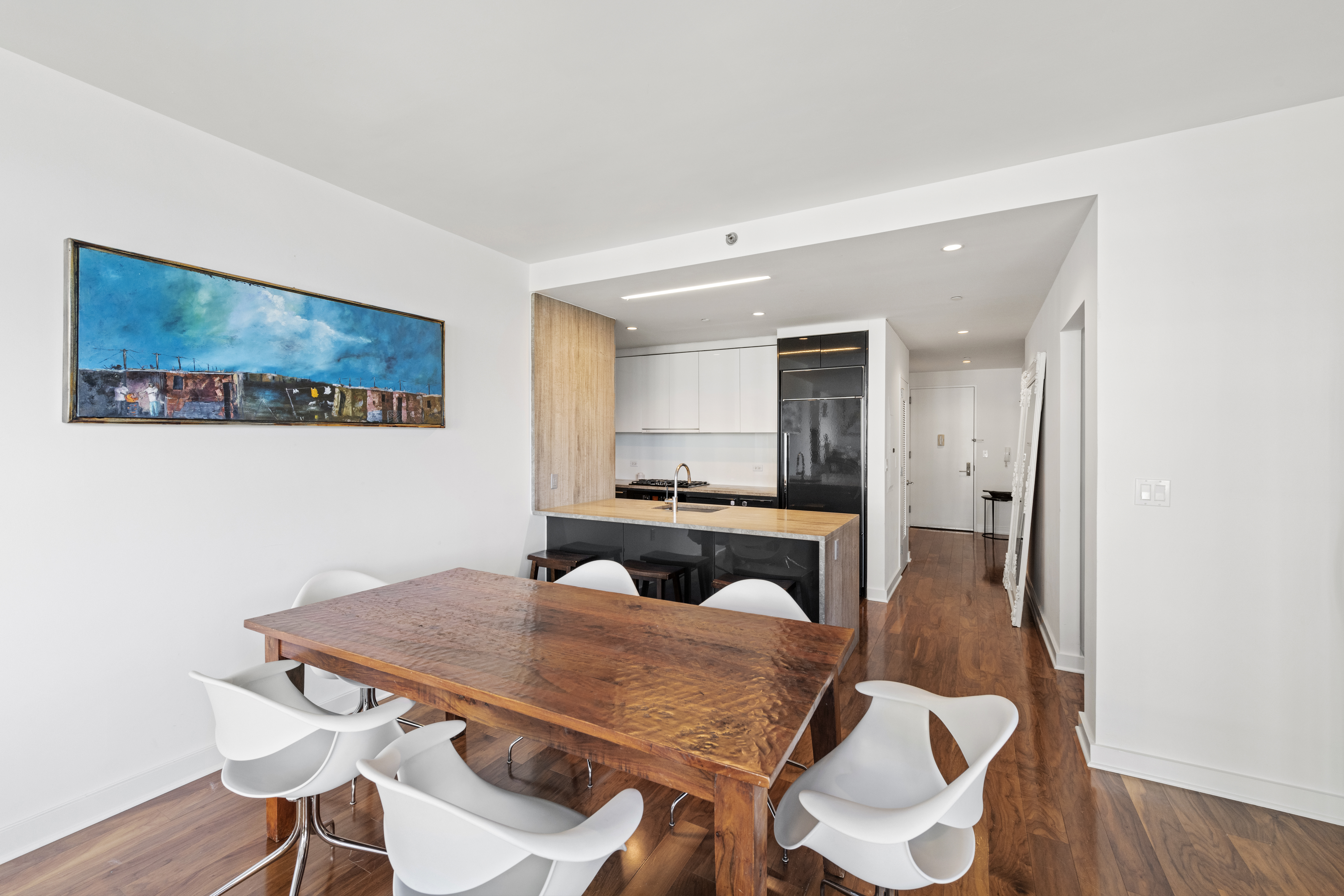 Brooklyn, NY 11249 - Photo 7 of 21 a view of a dining room with furniture and wooden floor