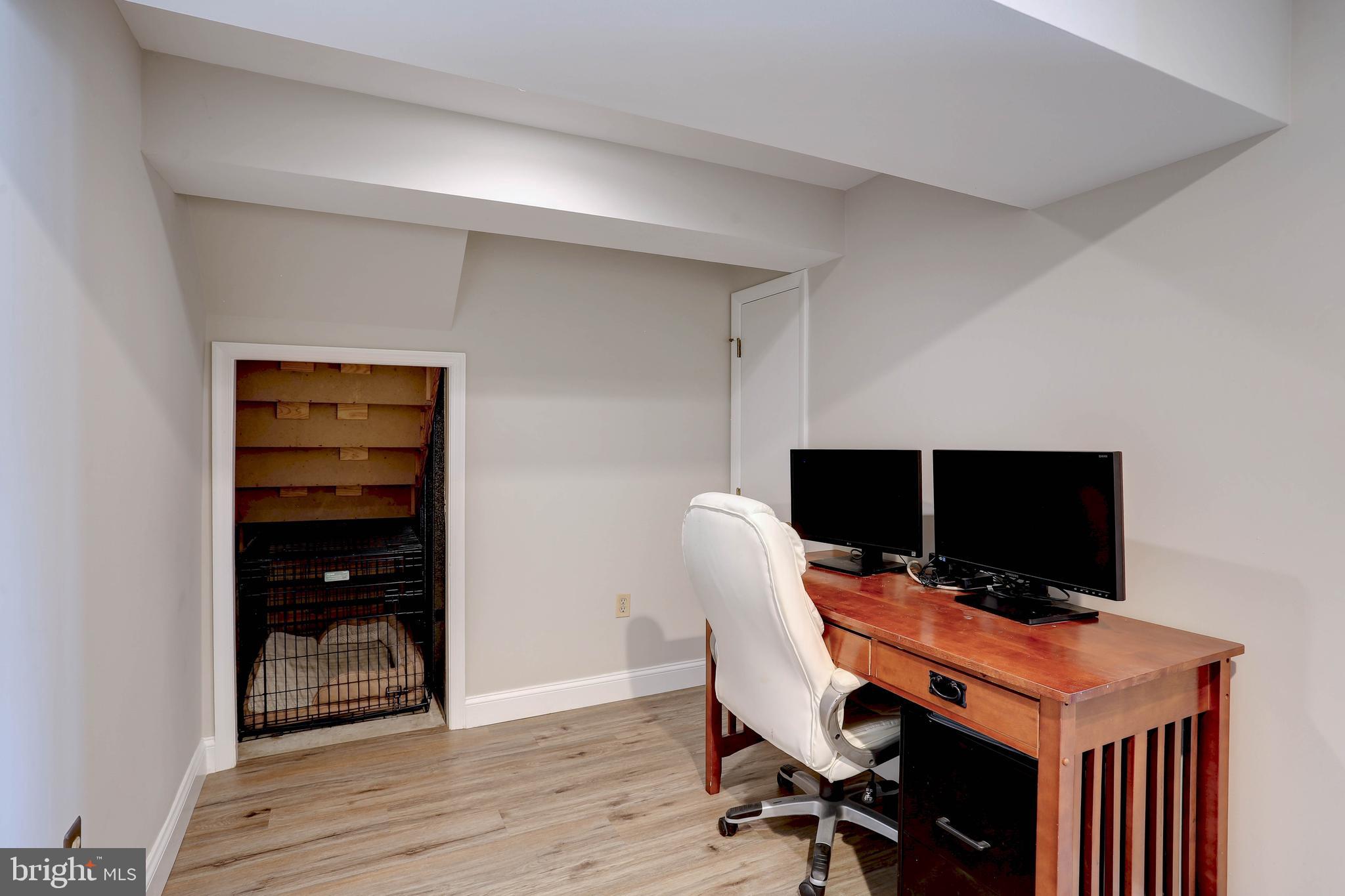 6257 Fairbourne Court Hanover, MD 21076 - Photo 37 of 47 a view of a workspace with furniture and wooden floor