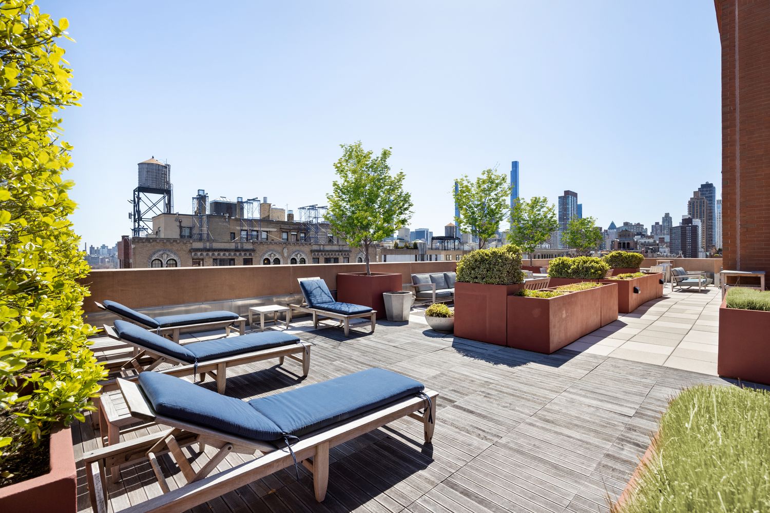 205 West 76th Street, Unit PH1F Manhattan, NY 10023 - Photo 13 of 18 a roof deck with a table and chairs