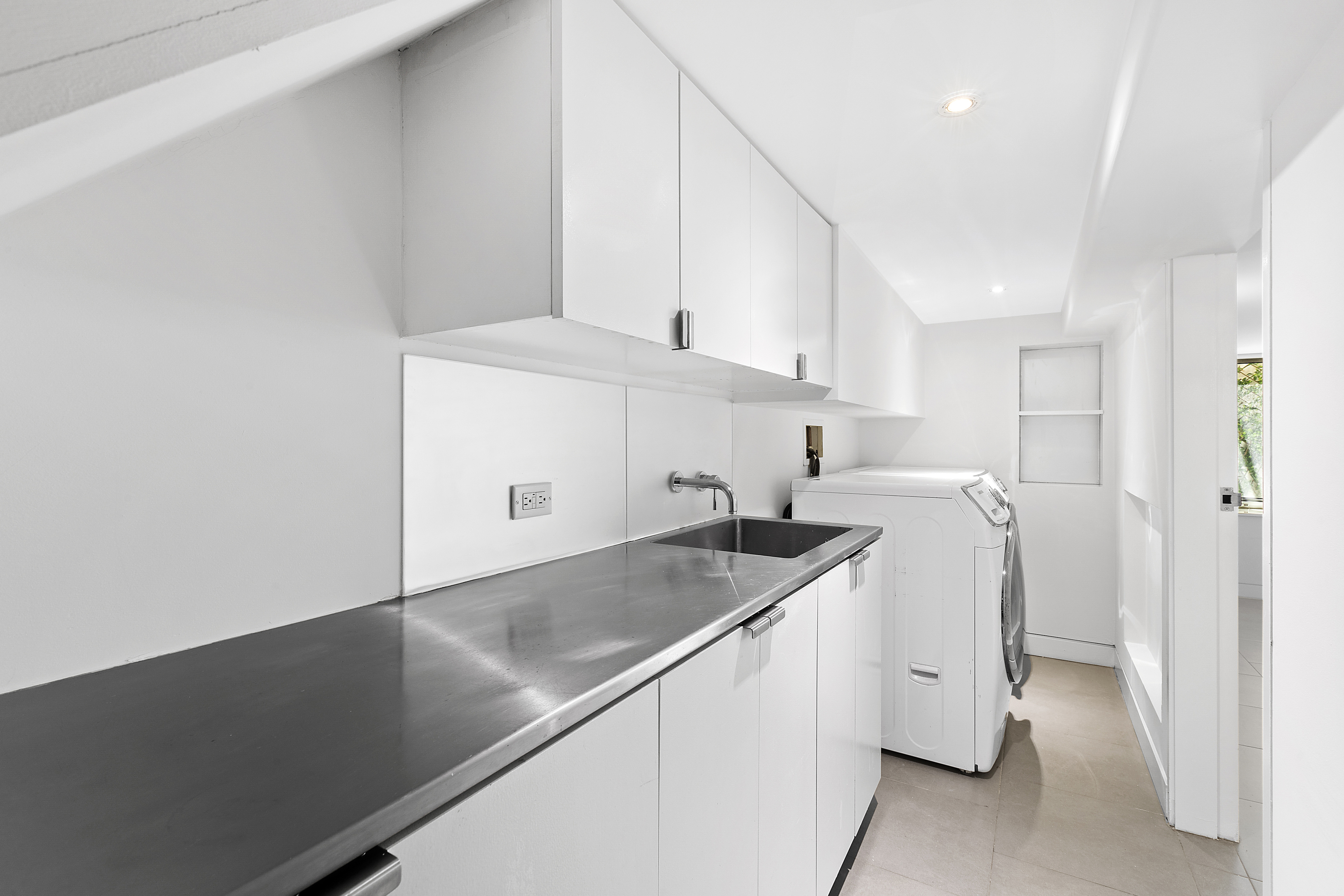 64 Clifton Place Brooklyn, NY 11238 - Photo 21 of 22 a kitchen with a sink a stove and cabinets
