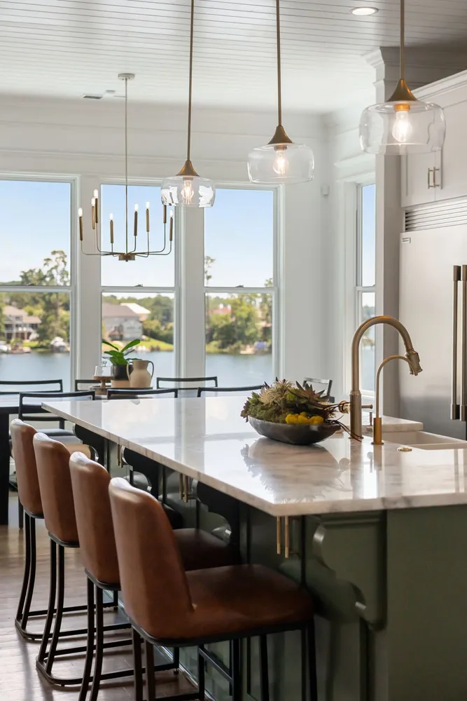 a dining room with furniture a chandelier and wooden floor