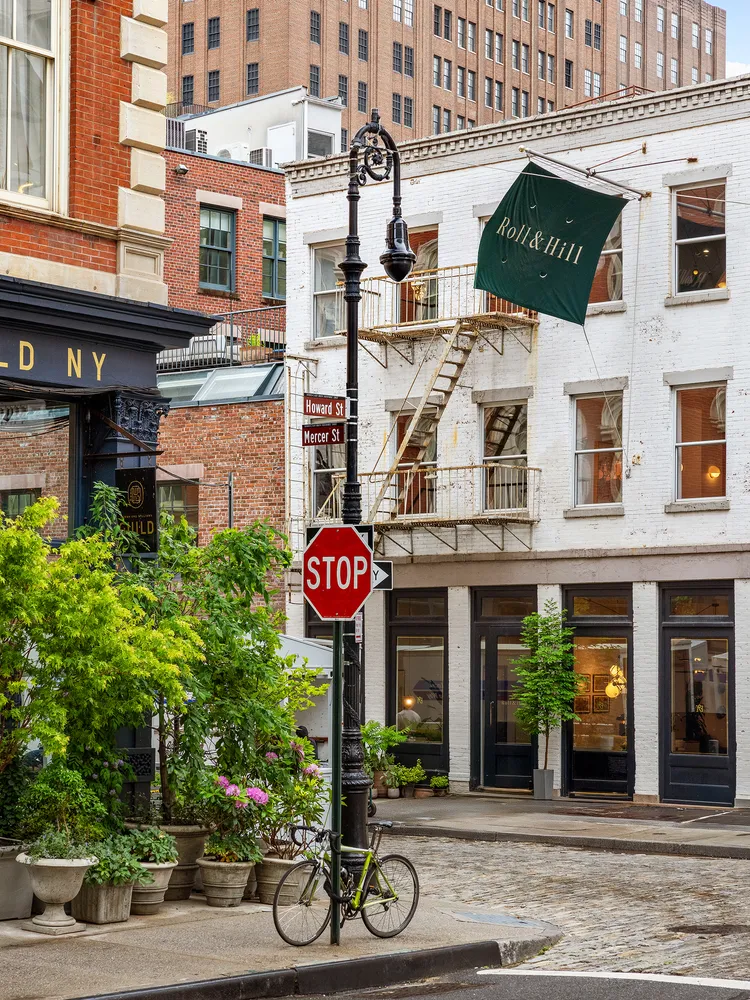 a view of a brick building with many windows