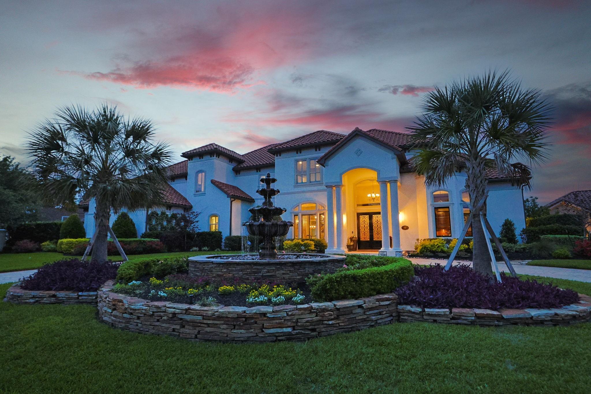 82 Manor Lake Estates Circle Spring, TX 77379 - Photo 50 of 52 a front view of a house with garden and trees