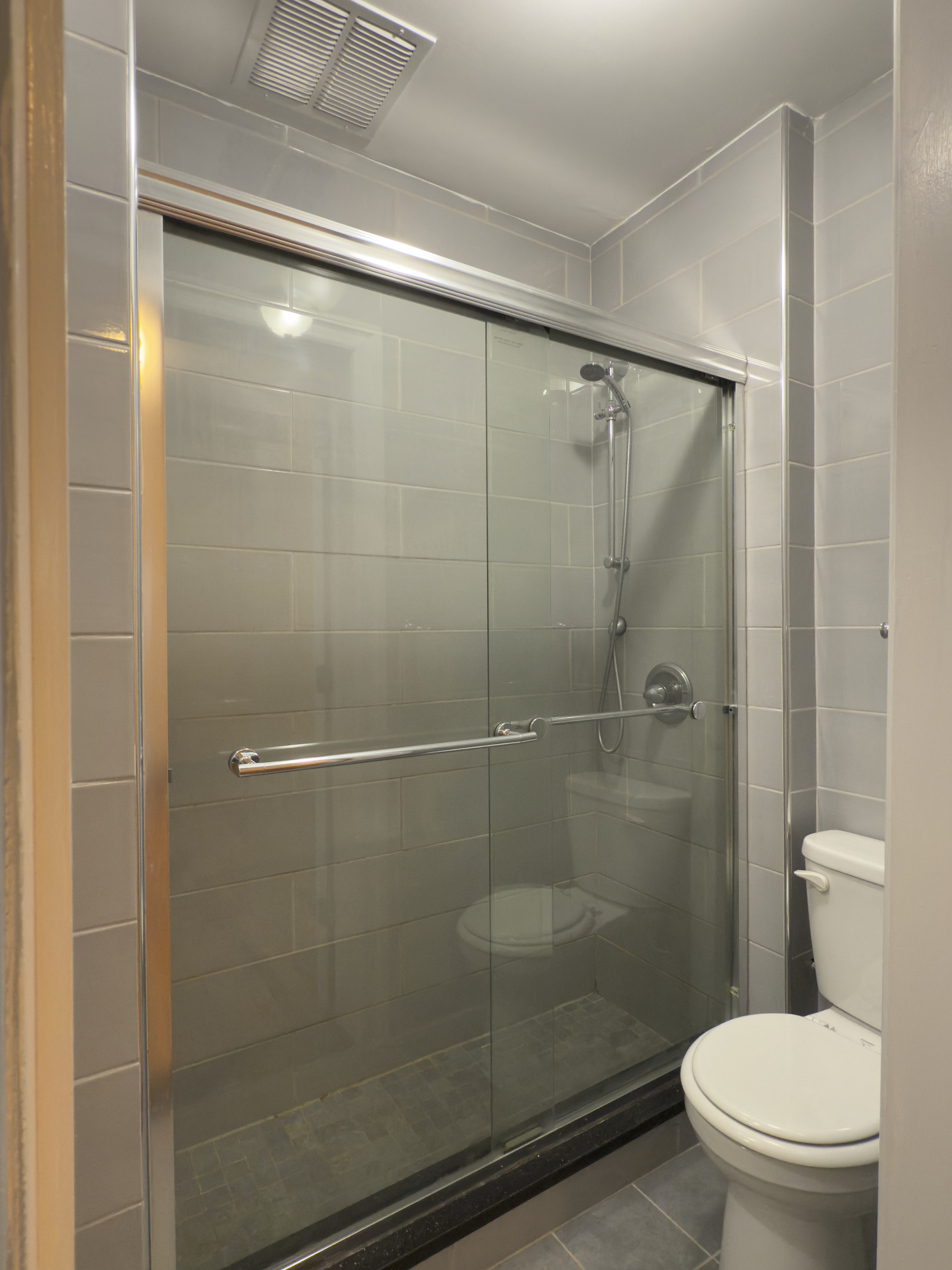 398 3rd Avenue, Unit 2C Manhattan, NY 10016 - Photo 6 of 6 a bathroom with a shower a toilet and a sink