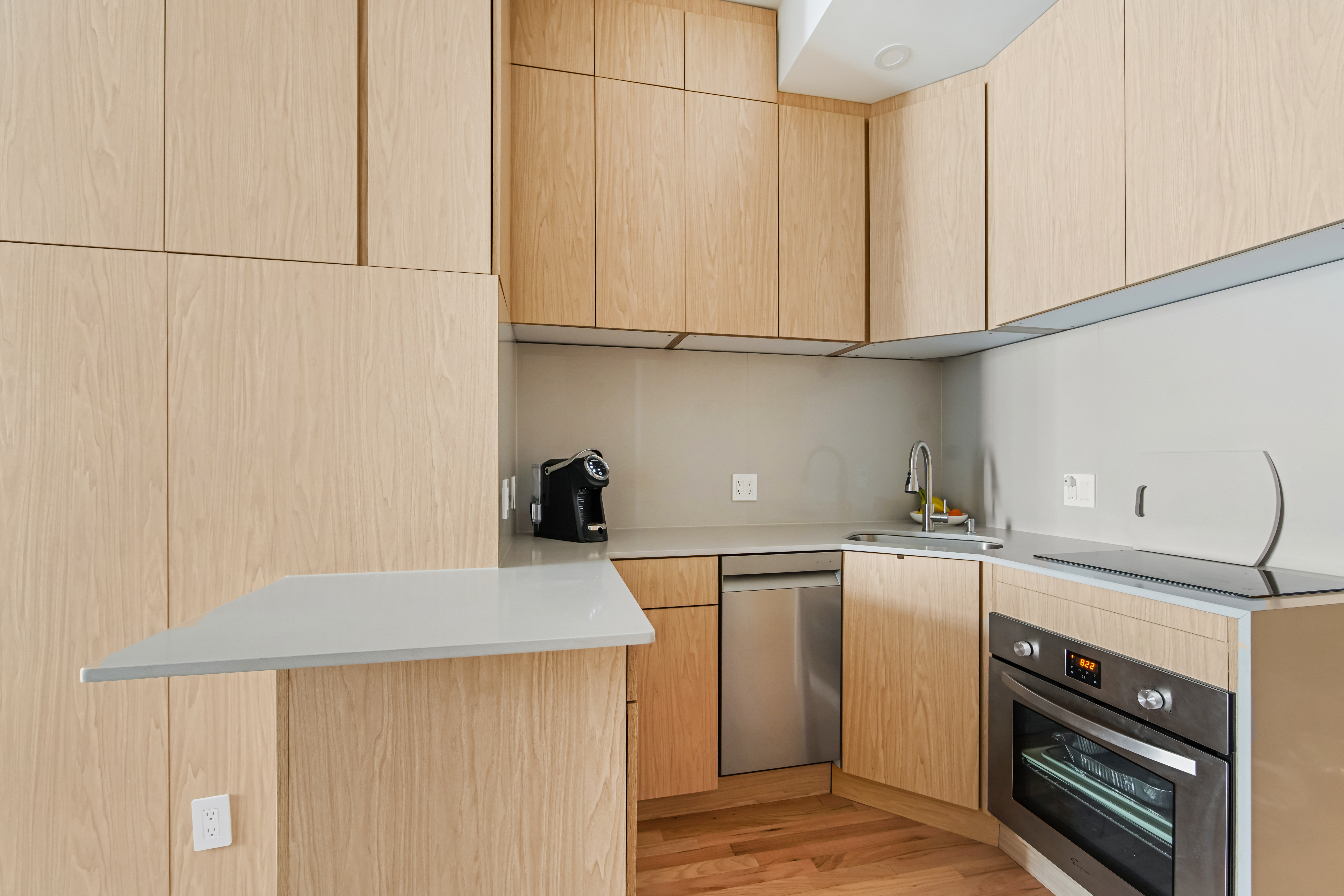 310 East 23rd Street, Unit 3B Manhattan, NY 10010 - Photo 7 of 11 a kitchen with a sink cabinets and appliances