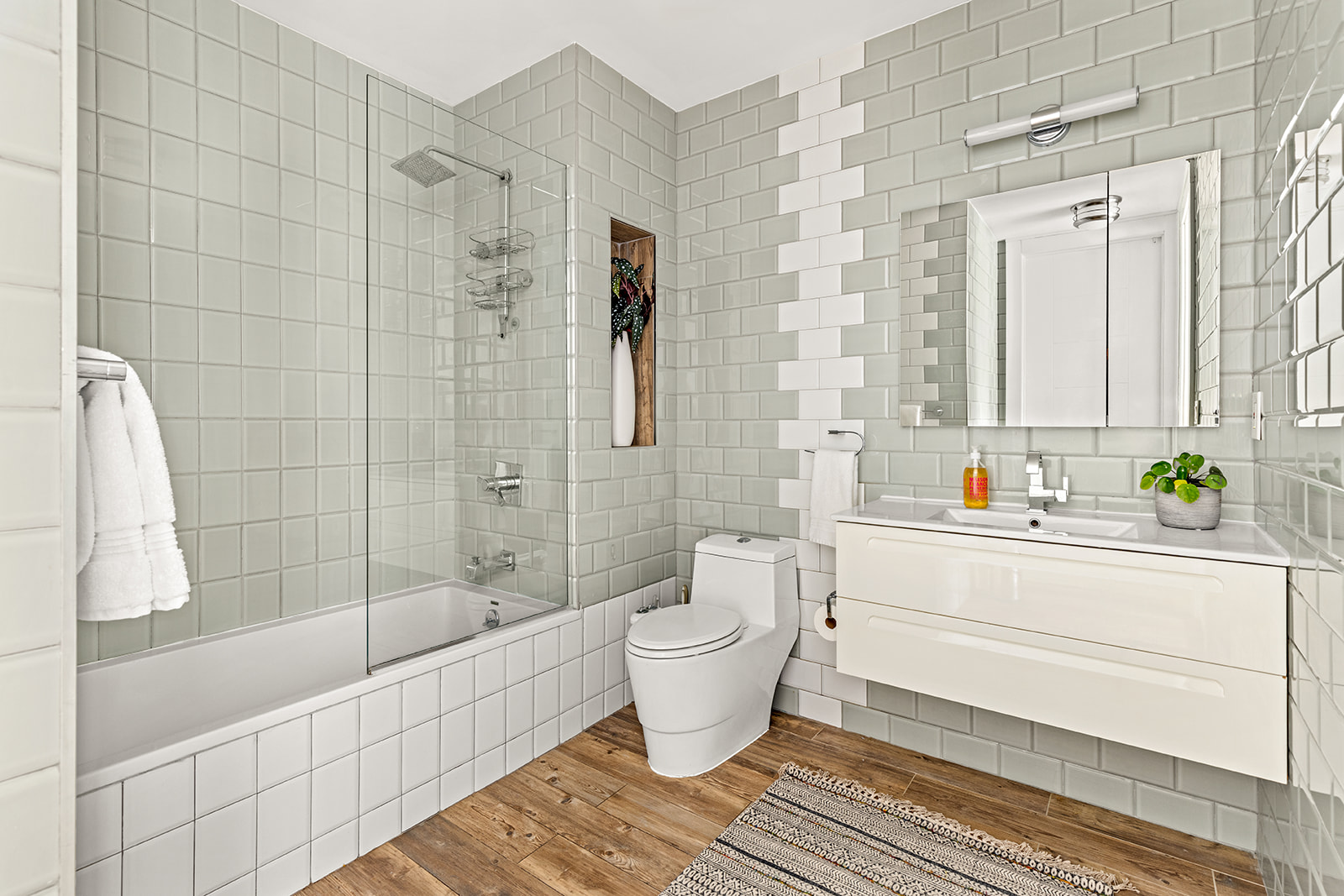 516 Classon Avenue, Unit 1B Brooklyn, NY 11238 - Photo 14 of 17 a bathroom with a bathtub shower sink mirror and toilet
