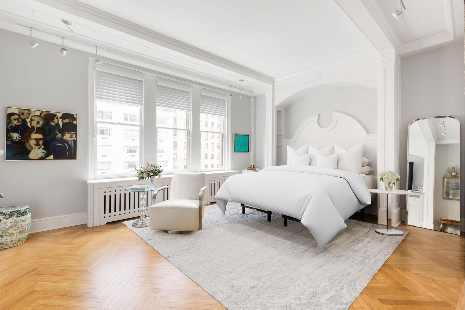 470 Park Avenue, Unit 10C Manhattan, NY 10022 - Photo 6 of 11 a spacious bedroom with a bed a couch and a window