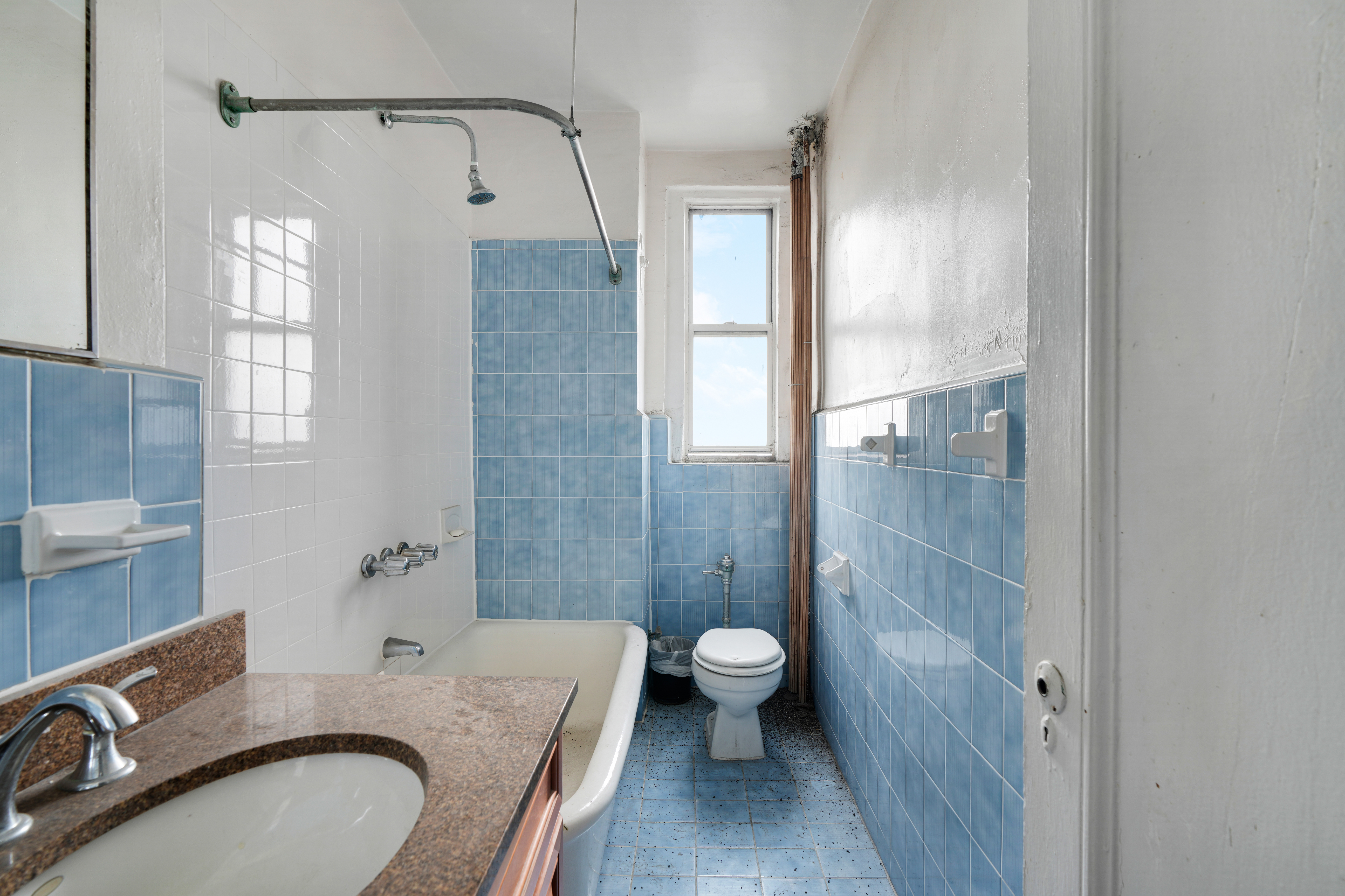 416 Ocean Avenue, Unit 62 Brooklyn, NY 11226 - Photo 12 of 22 a bathroom with a granite countertop sink toilet and shower