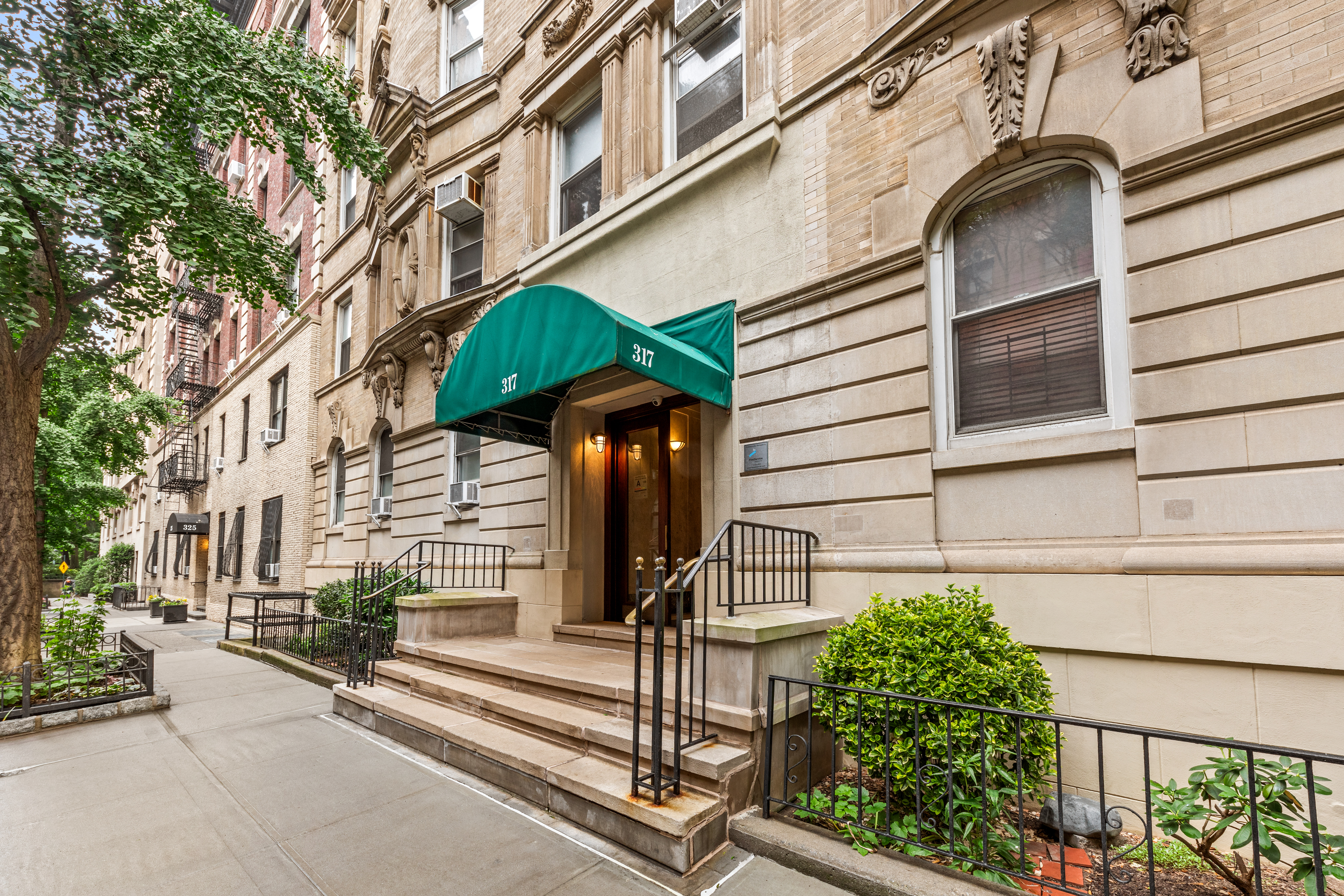 317 West 93rd Street, Unit 1C Manhattan, NY 10025 - Photo 8 of 9 a view of a house with a street