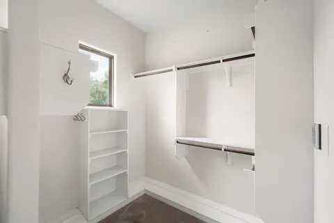 a view of a house with garden and a sitting area