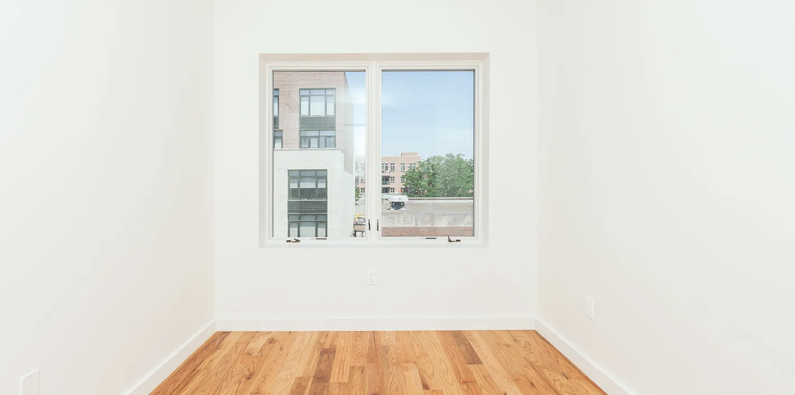 131 North 5th Street, Unit 4 Brooklyn, NY 11249 - Photo 3 of 6 a view of a room that has a window and wooden floor