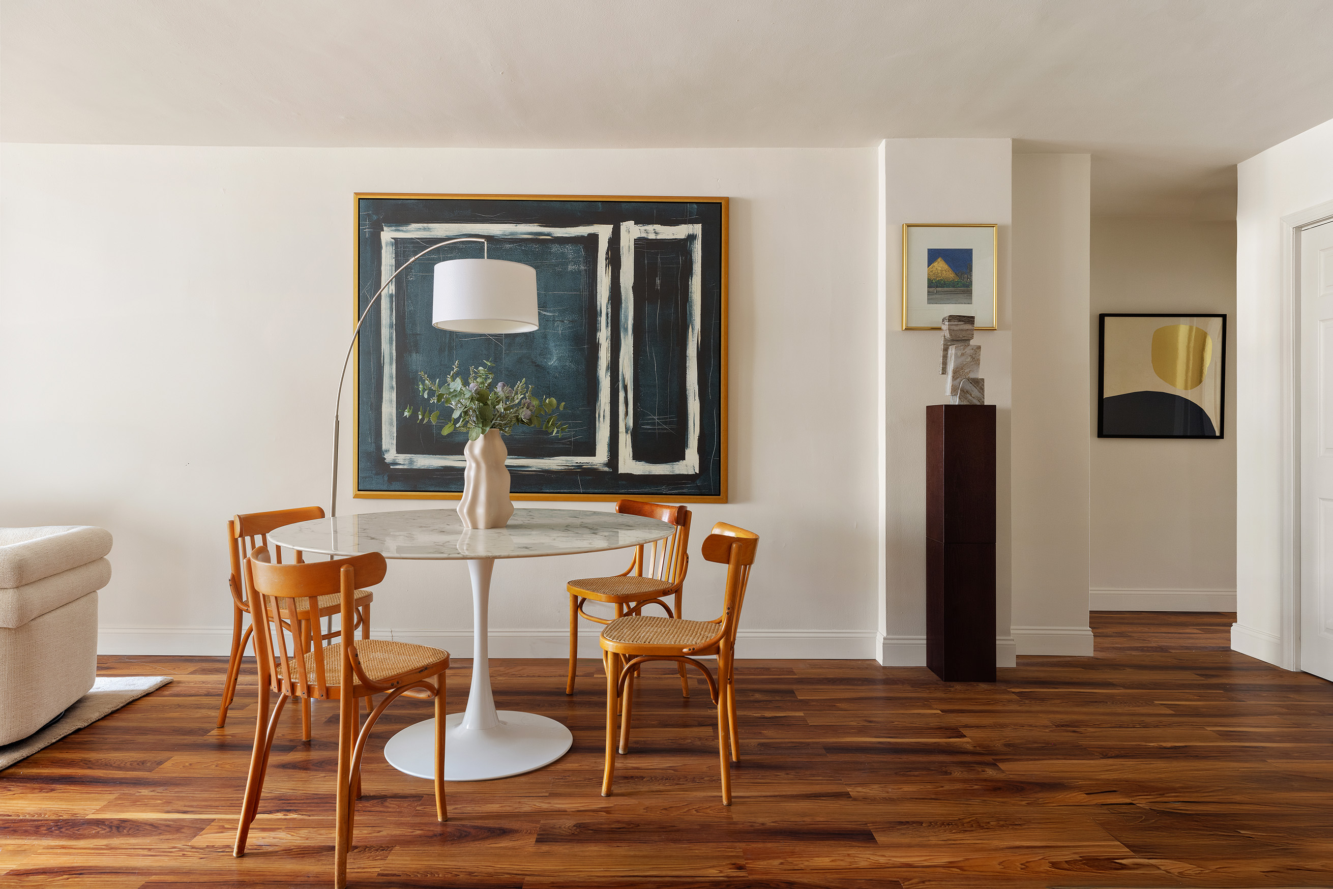 345 East 73rd Street, Unit 9H Manhattan, NY 10021 - Photo 4 of 13 a view of a dining room with furniture and wooden floor