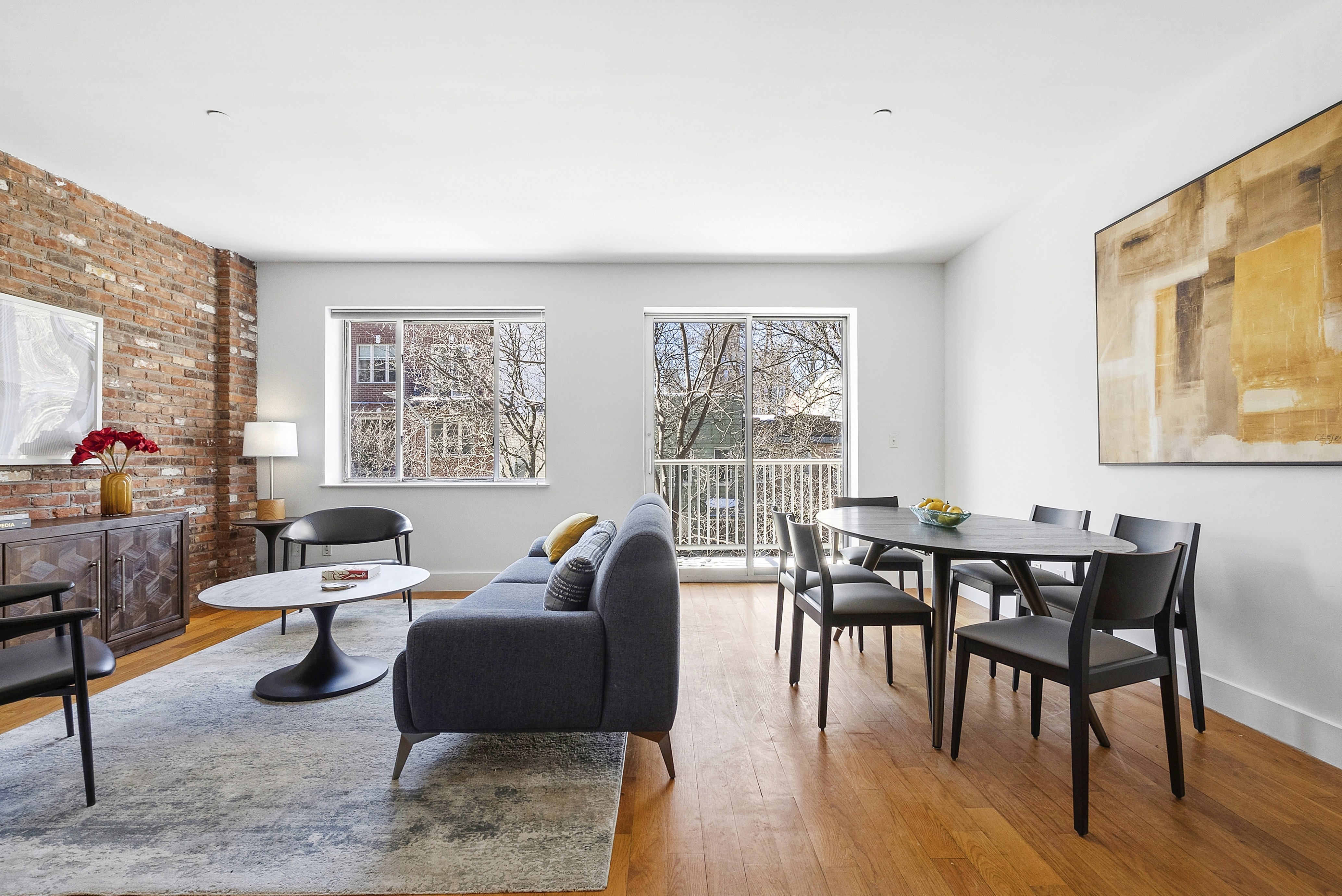 a view of a livingroom with furniture and a window