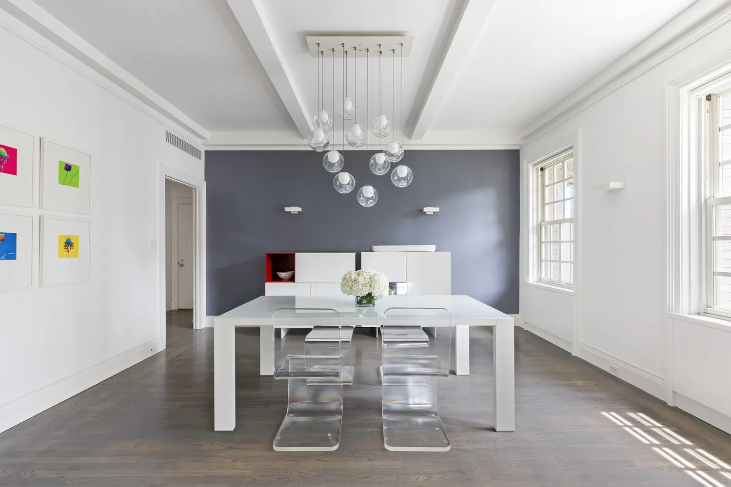a view of a dining room with furniture and chandelier
