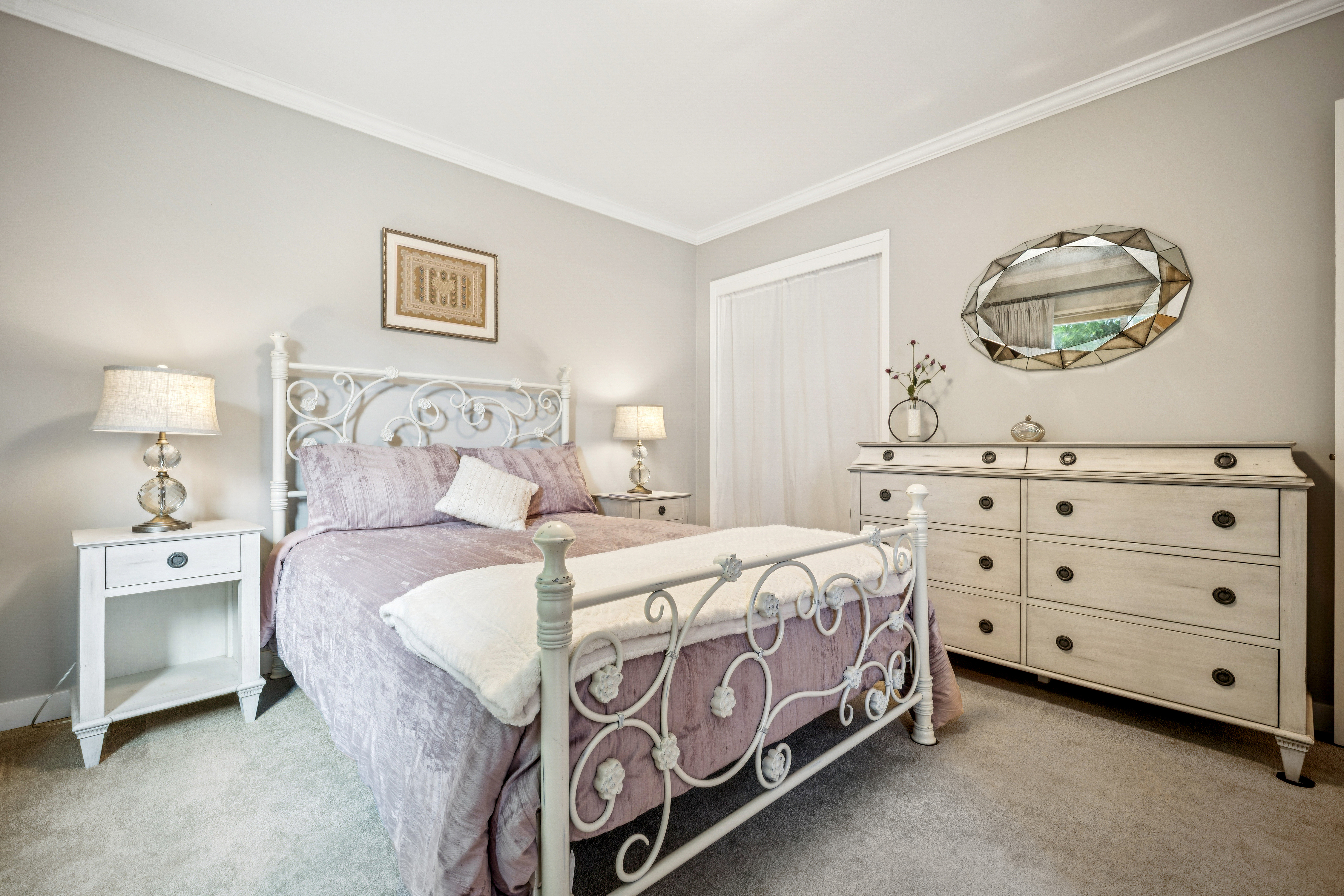 77 Bothin Road Fairfax, CA 94930 - Photo 13 of 32 a bedroom with a bed and a chandelier
