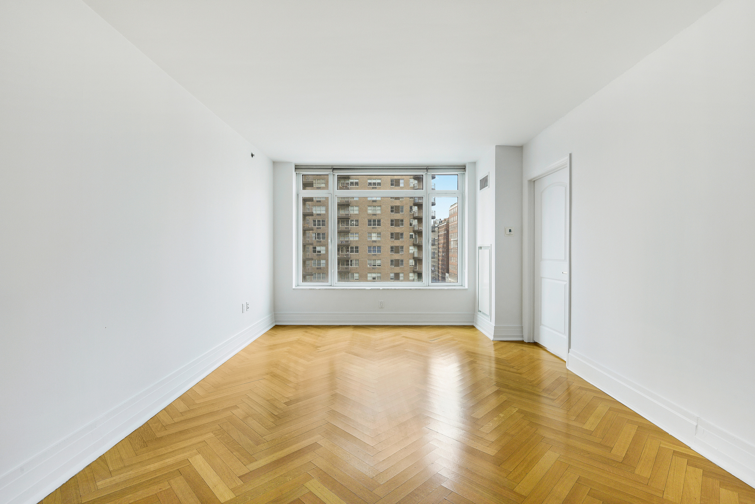 205 East 85th Street, Unit 12H Manhattan, NY 10028 - Photo 6 of 19 a view of a room with natural light