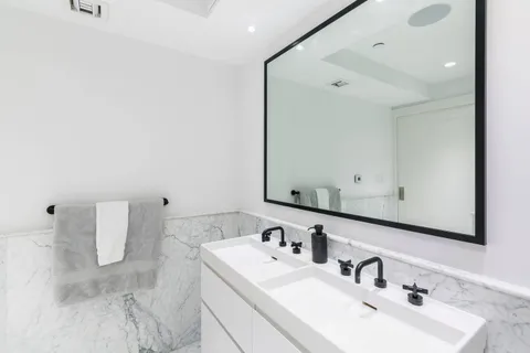 a bathroom with a bathtub and shower