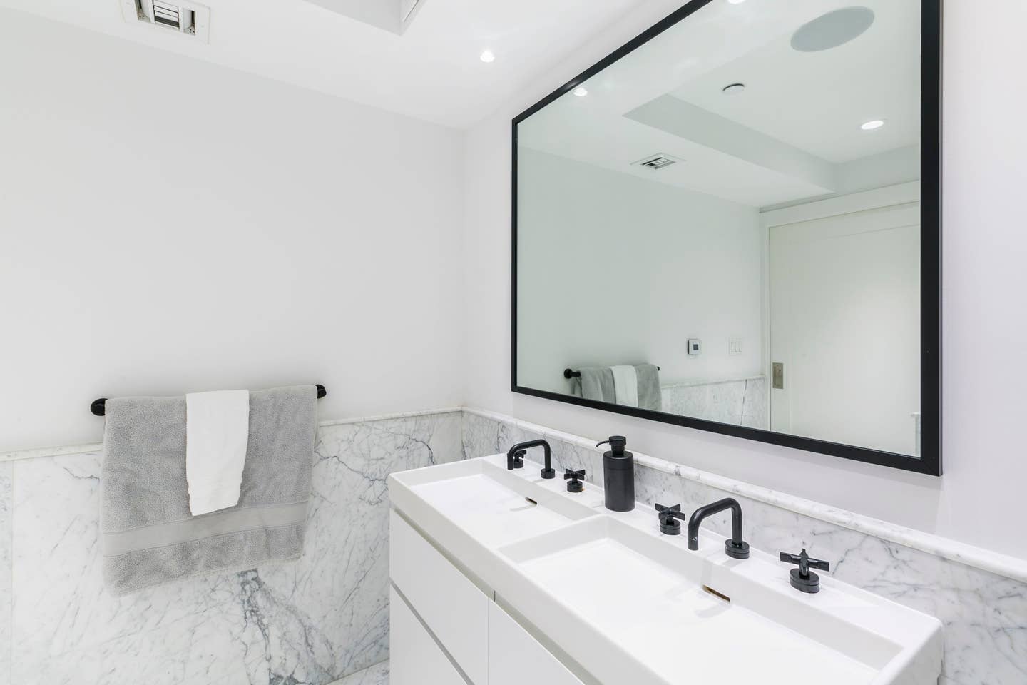 265 East Houston Street, Unit 4 Manhattan, NY 10002 - Photo 12 of 20 a bathroom with a sink and a mirror