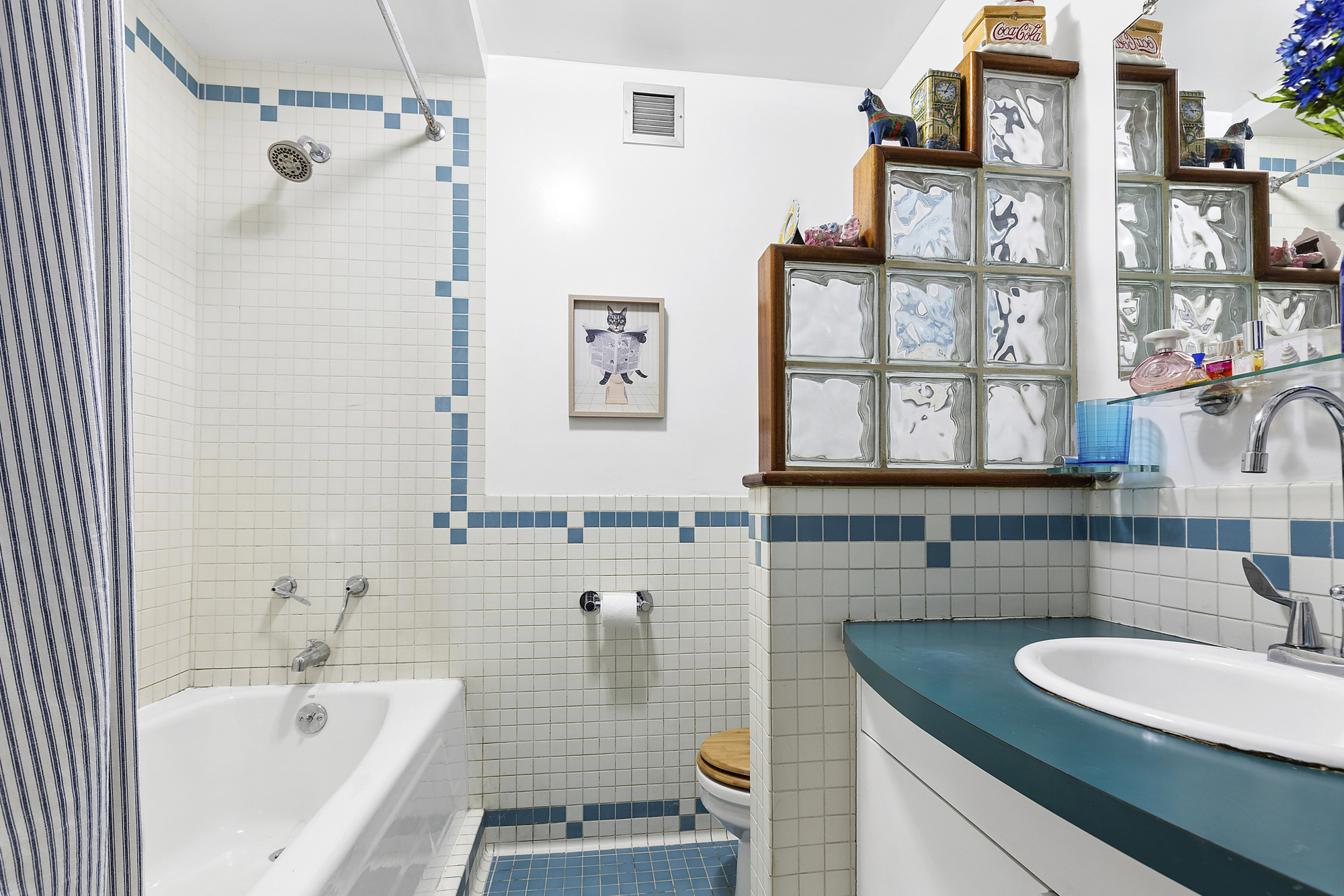 101 West 12th Street, Unit 15JK Manhattan, NY 10011 - Photo 16 of 22 a bathroom with a granite countertop sink and a bathtub