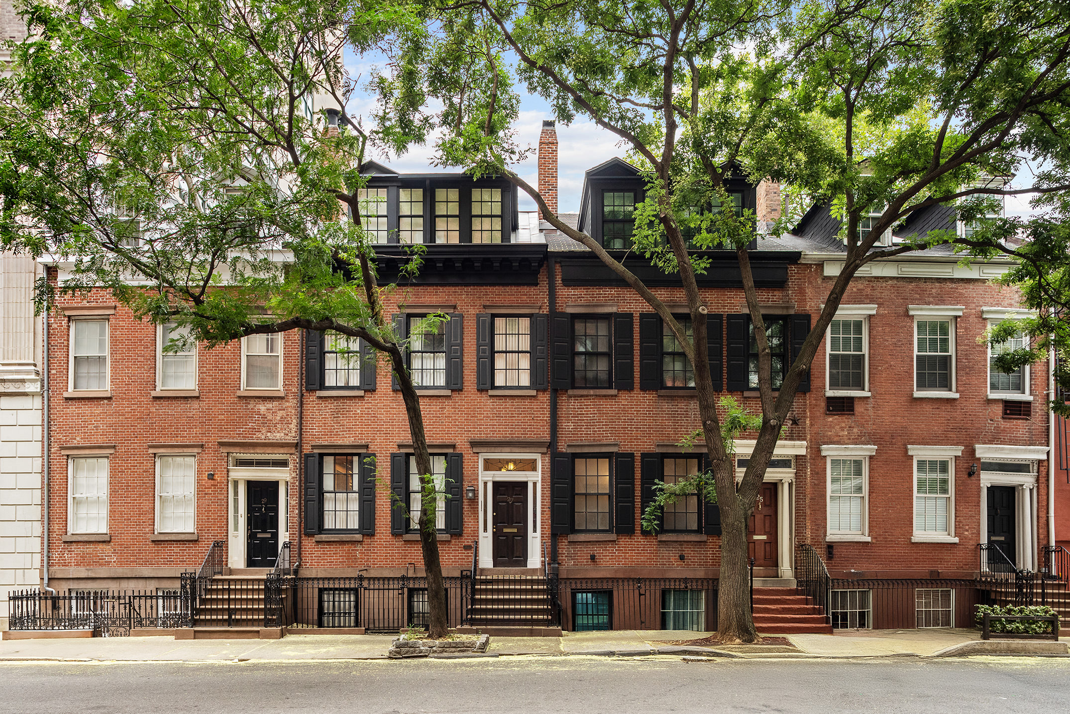 29 Vandam Street Manhattan, NY 10014 - Photo 16 of 17 a front view of a residential apartment building with a yard