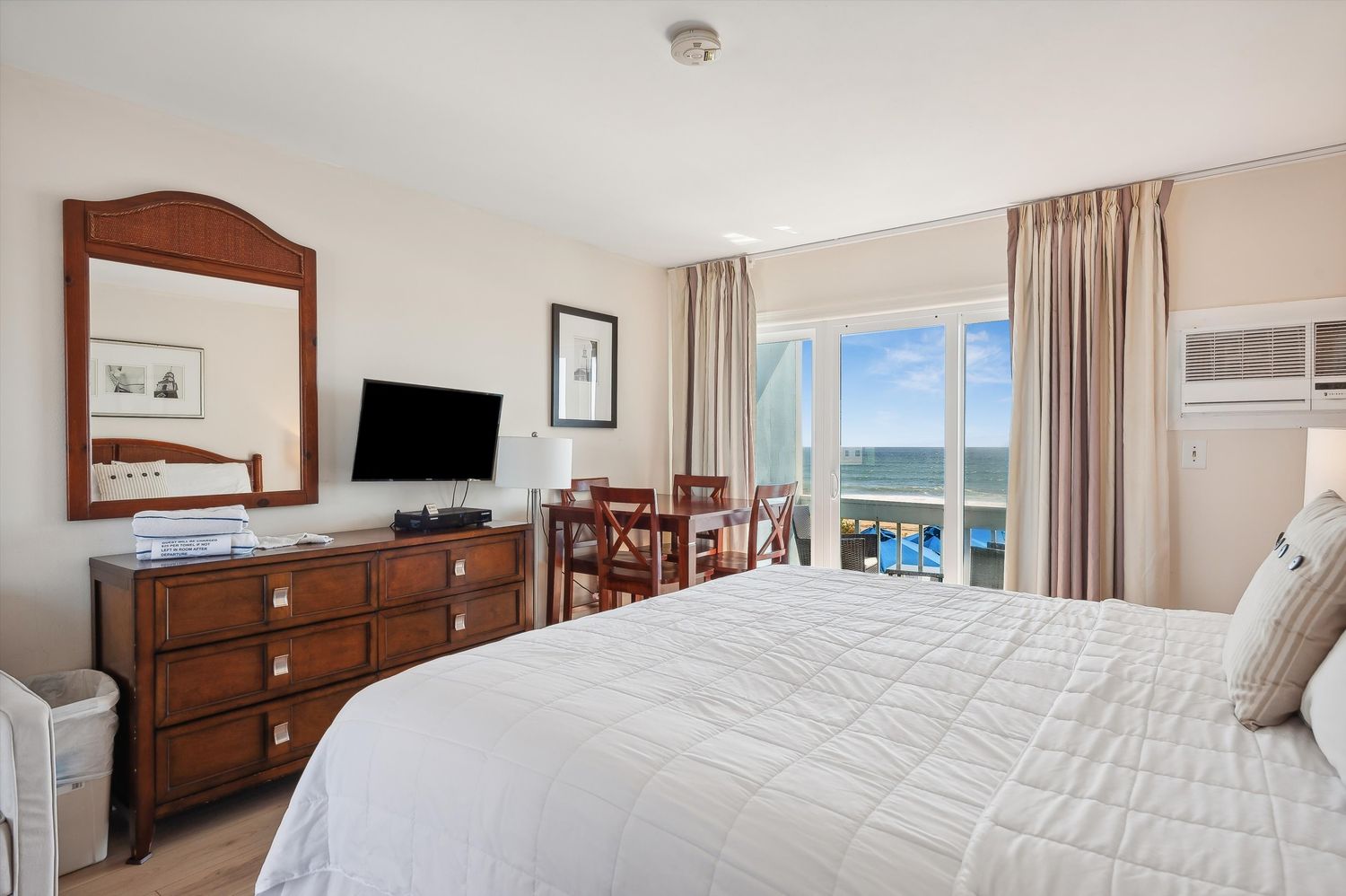 a bedroom with bed and large window
