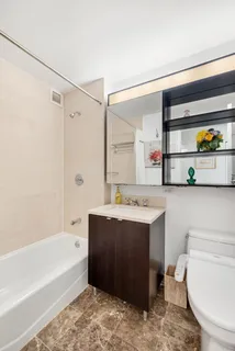 a view of bathroom with bathtub and toilet