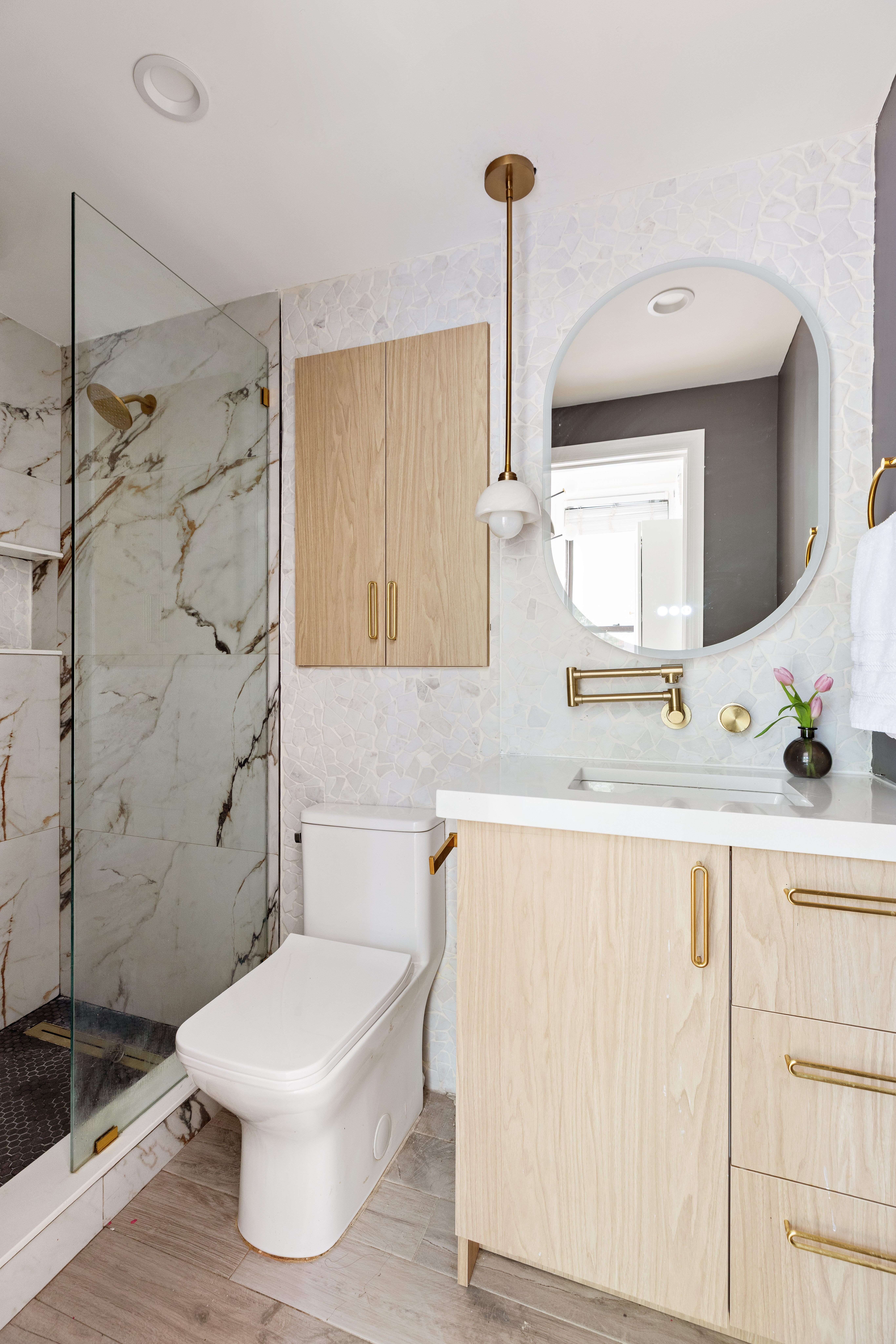 663 Greene Avenue Brooklyn, NY 11221 - Photo 4 of 14 a bathroom with a sink a toilet and shower