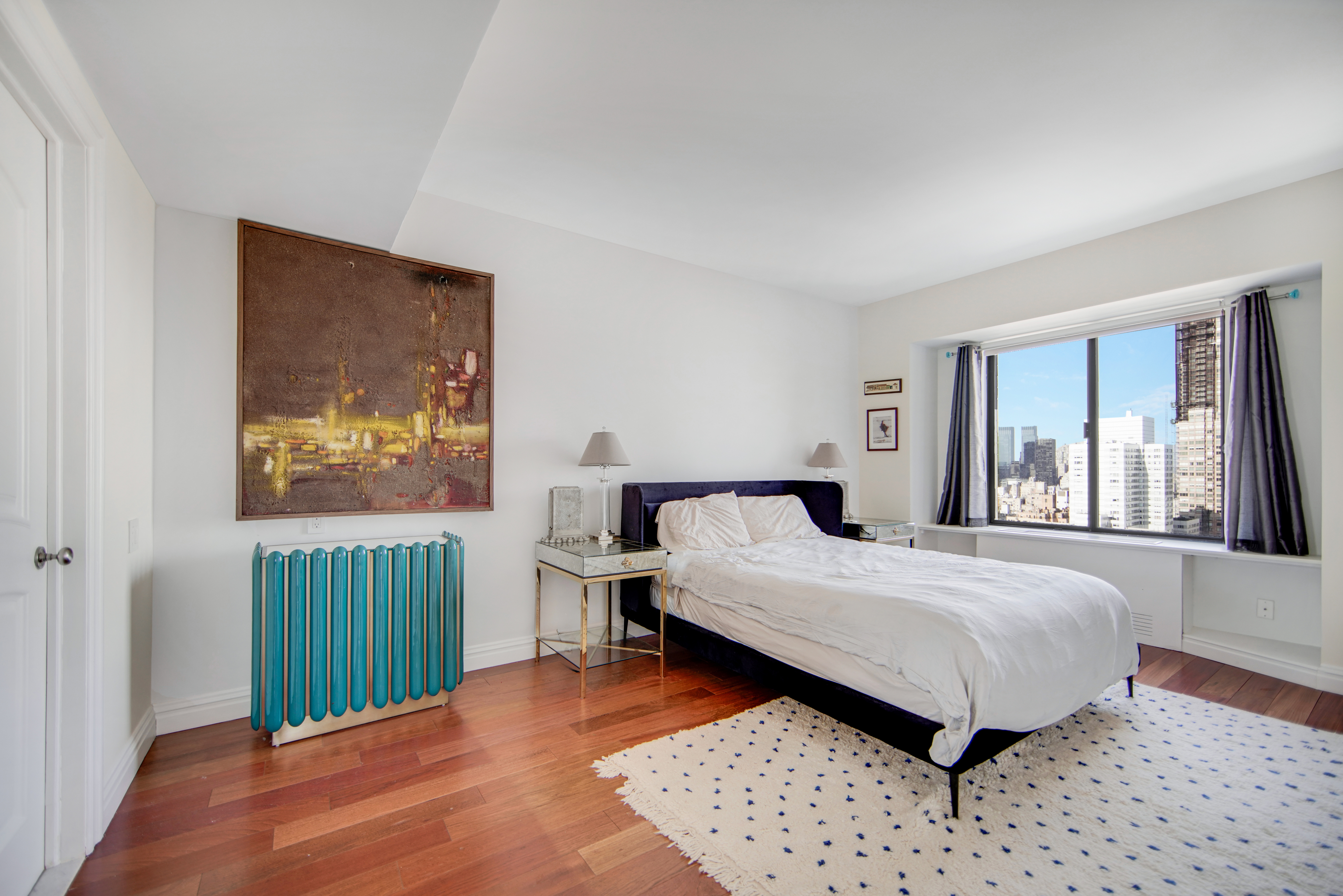 400 East 70th Street, Unit 3301 Manhattan, NY 10021 - Photo 9 of 20 a bedroom with a bed and a window