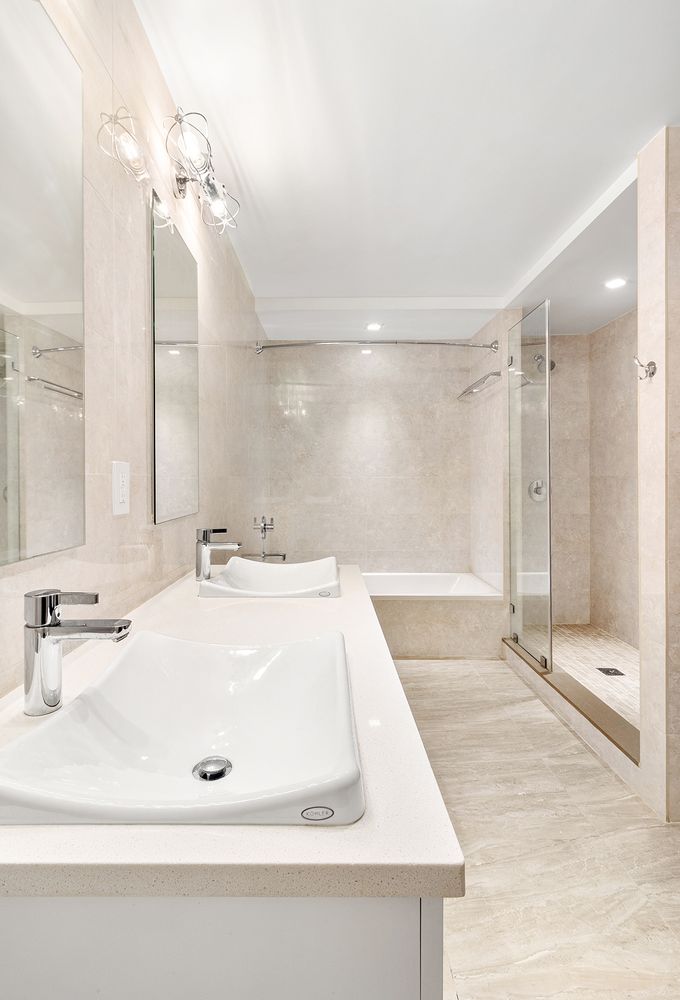 133 Mulberry Street, Unit 5A Manhattan, NY 10013 - Photo 8 of 15 a bathroom with a sink and a mirror