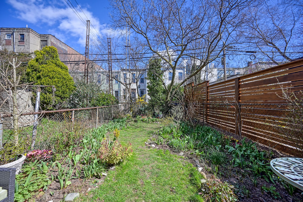 315 15th Street Brooklyn, NY 11215 - Photo 23 of 25 a backyard of a house with lots of green space