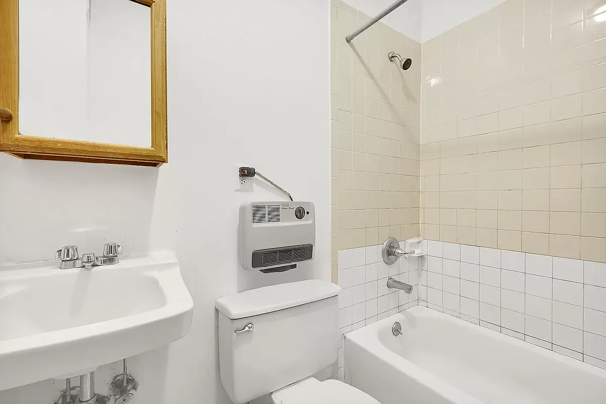 949 Columbus Avenue, Unit 1 Manhattan, NY 10025 - Photo 5 of 6 a bathroom with a sink and a bathtub