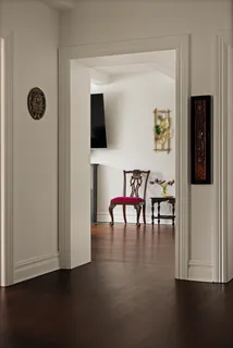 a view of dining room with furniture and wooden floor