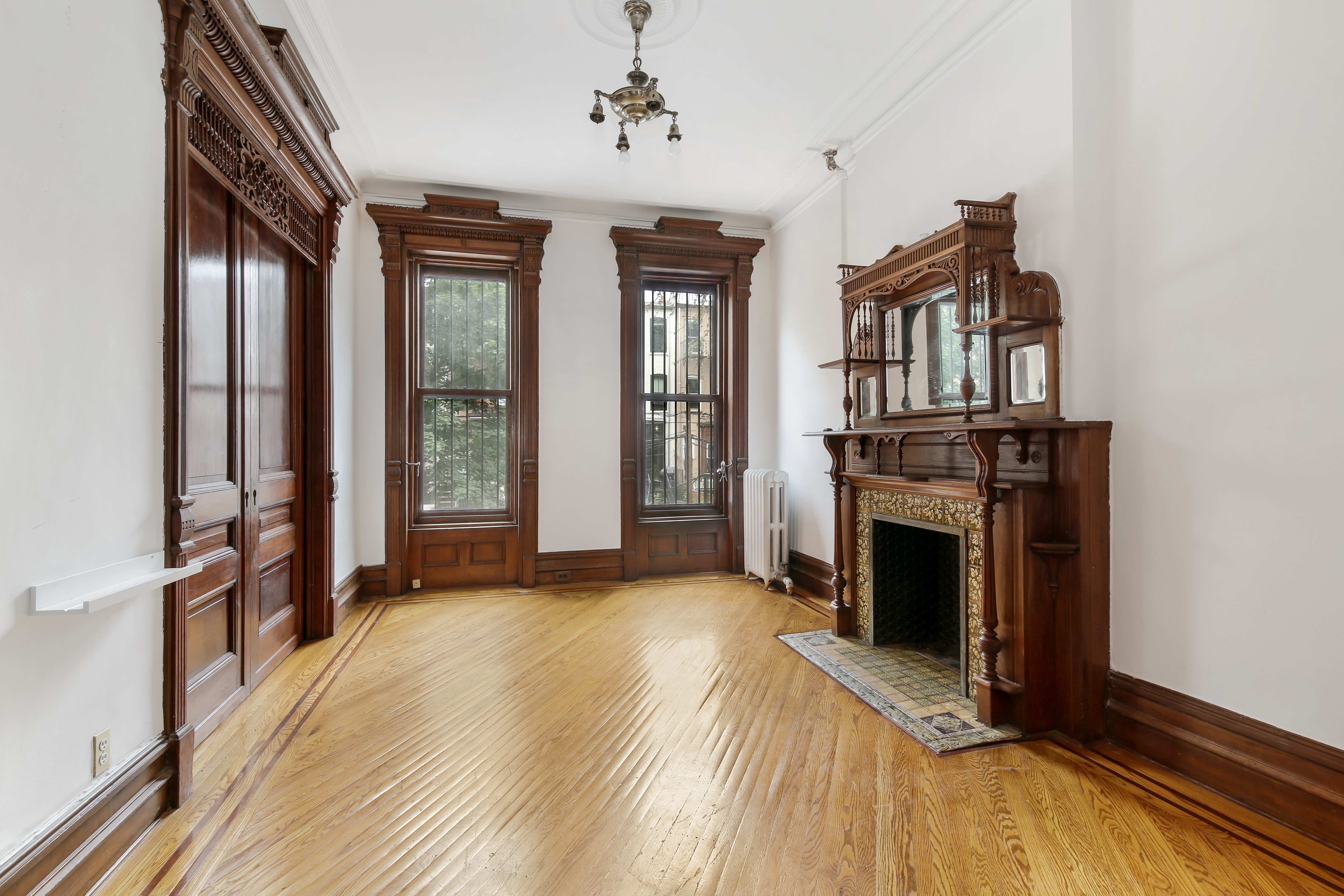 666 Putnam Avenue, Unit 1 Brooklyn, NY 11221 - Photo 4 of 8 a view of livingroom with furniture and fireplace