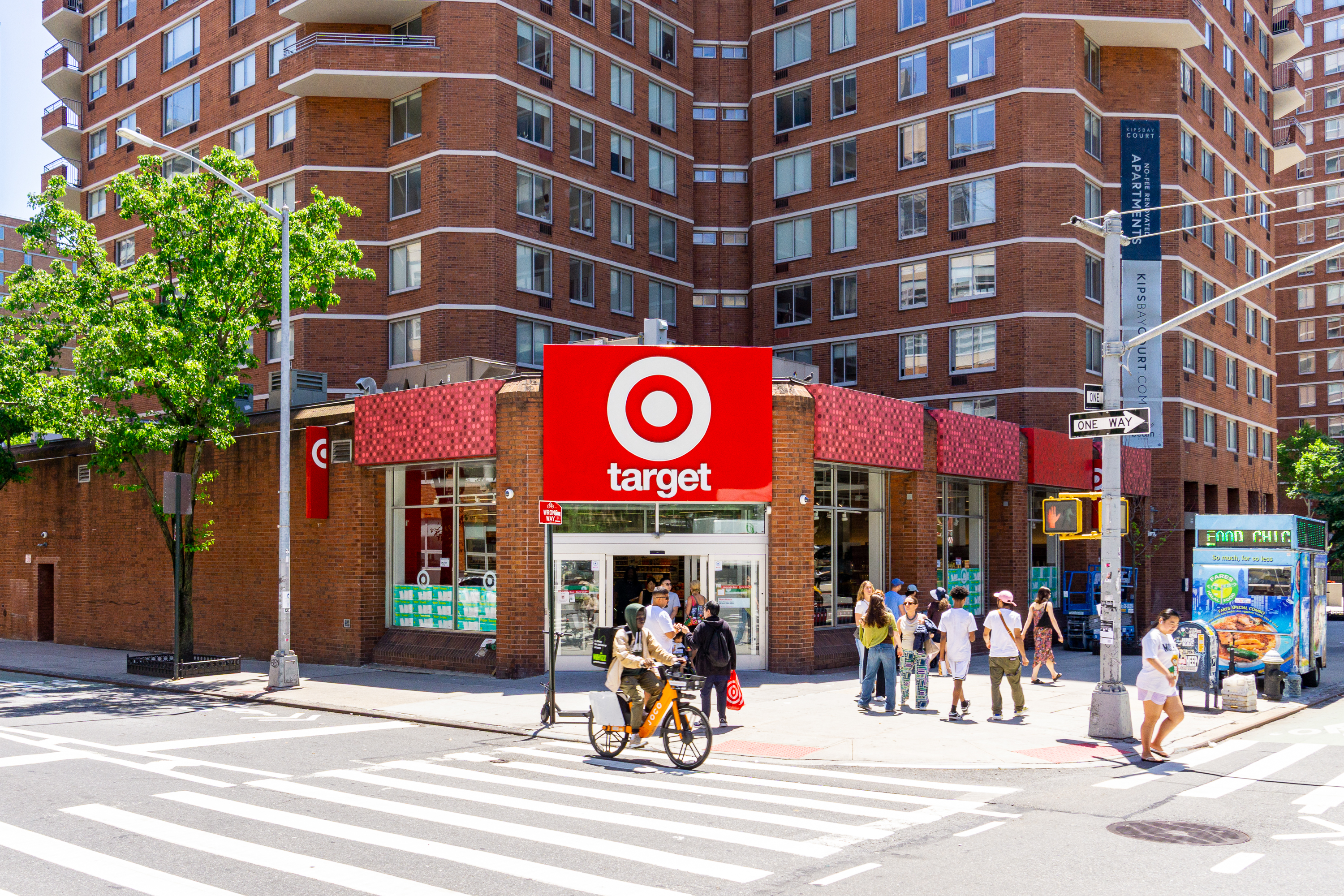 319 East 25th Street, Unit 1B Manhattan, NY 10010 - Photo 11 of 15 a view of a building with a people on a street