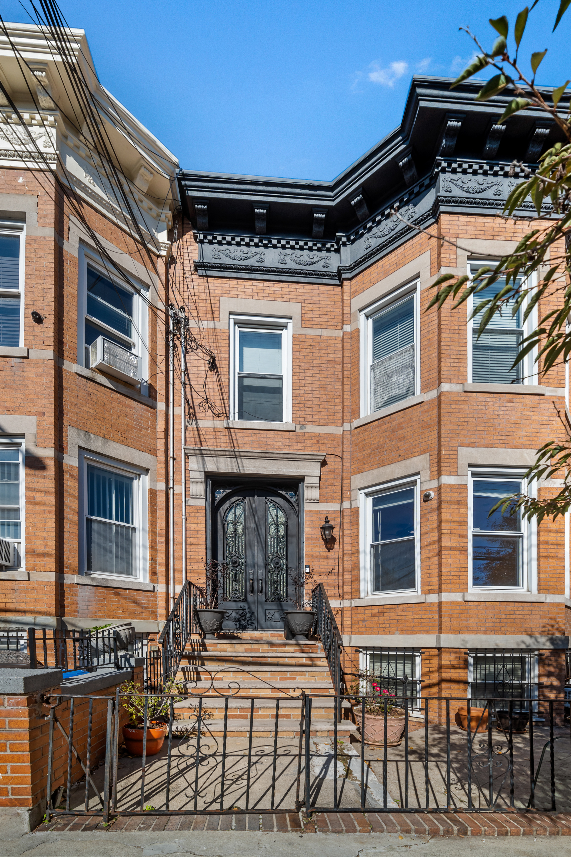 60-13 Menahan Street, Unit 1 Queens, NY 11385 - Photo 18 of 19 a view of a house with a patio