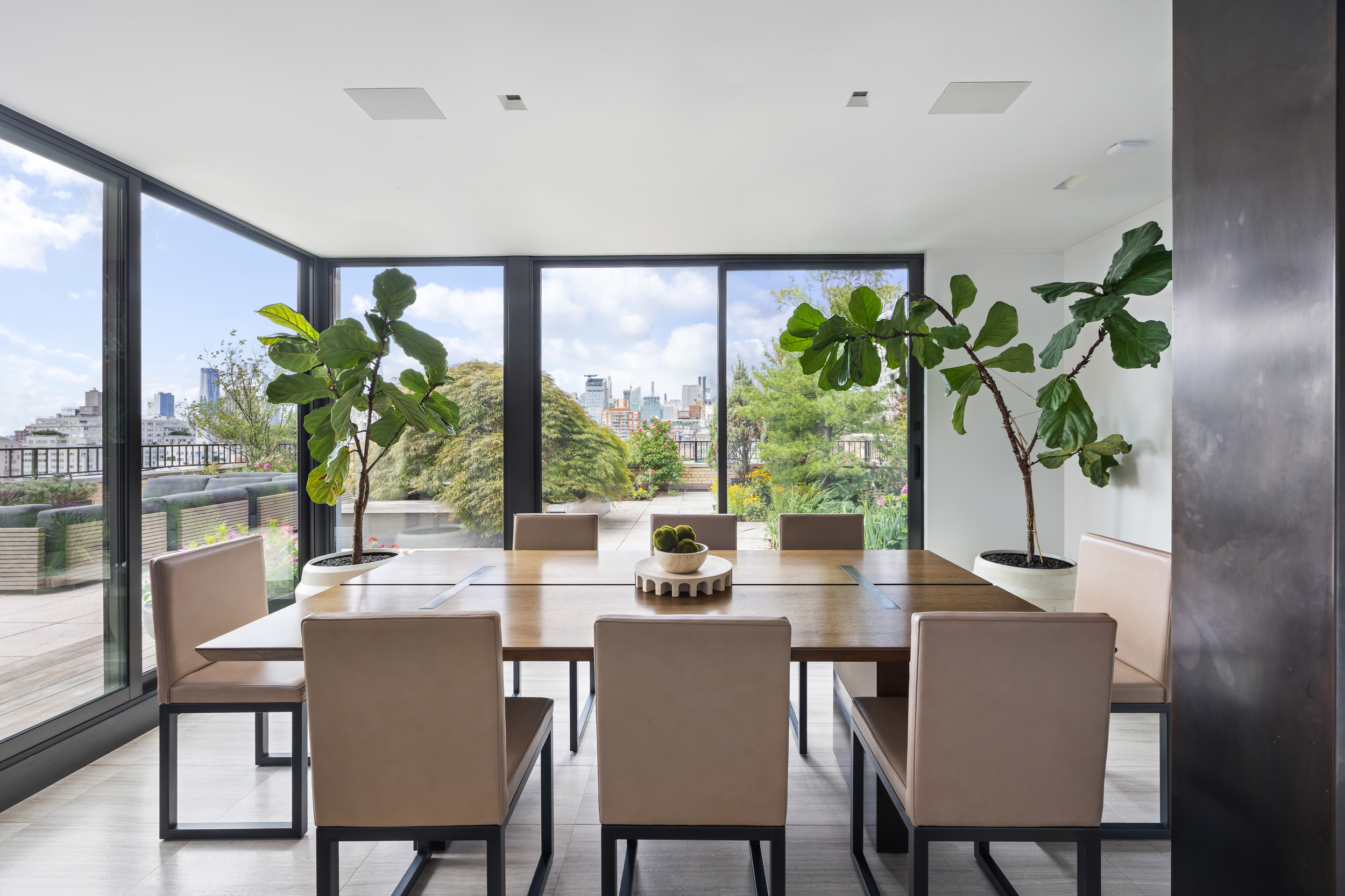 24 5th Avenue, Unit PH1701 Manhattan, NY 10011 - Photo 8 of 24 a dining room with furniture window and wooden floor