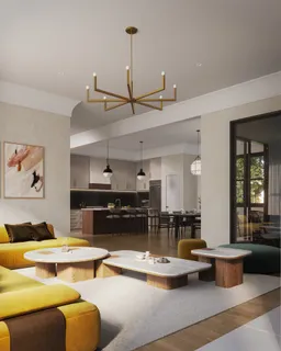 a living room with furniture kitchen view and a chandelier