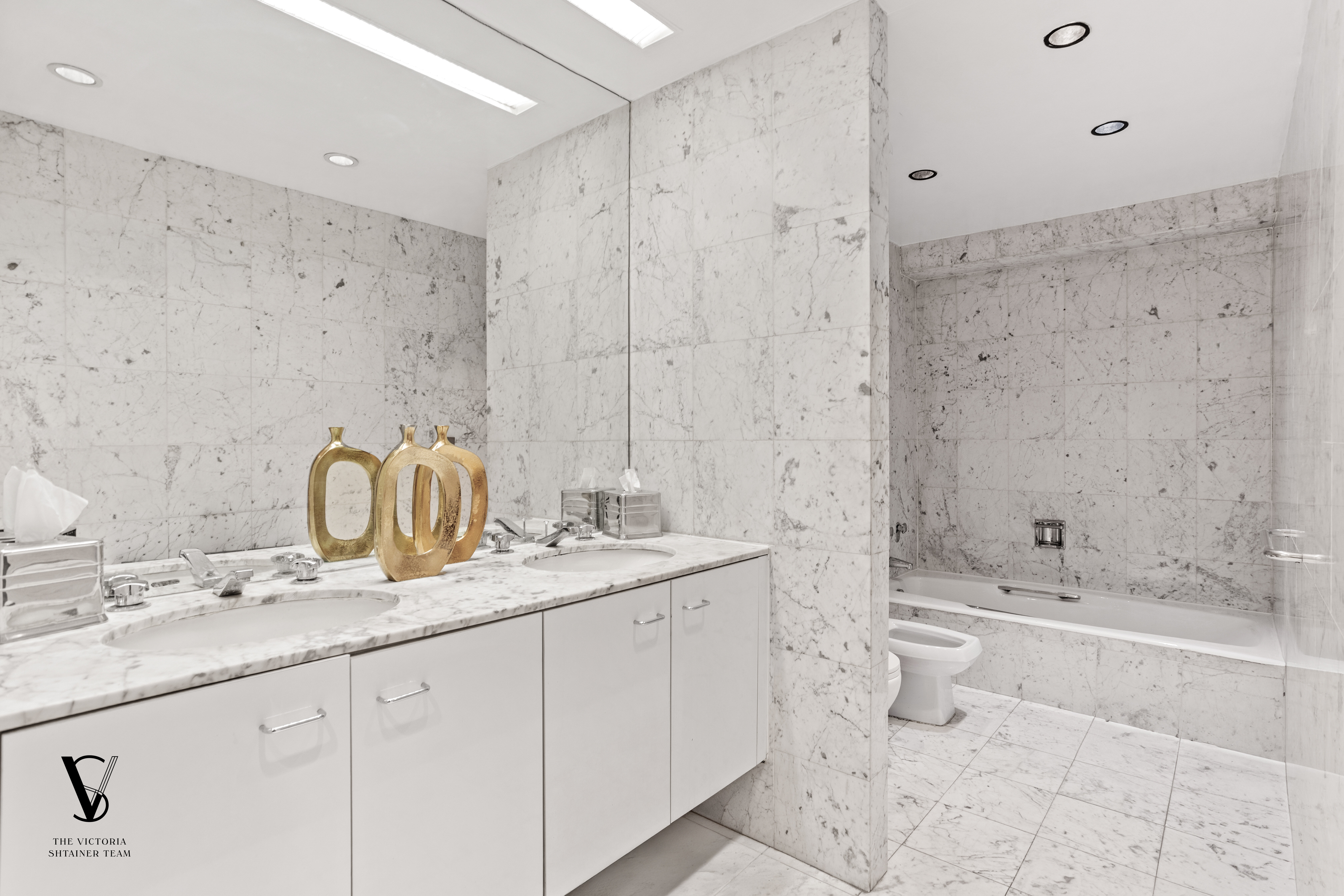 415 East 54th Street, Unit 6D Manhattan, NY 10022 - Photo 9 of 18 a bathroom with a granite countertop sink a toilet and bathtub