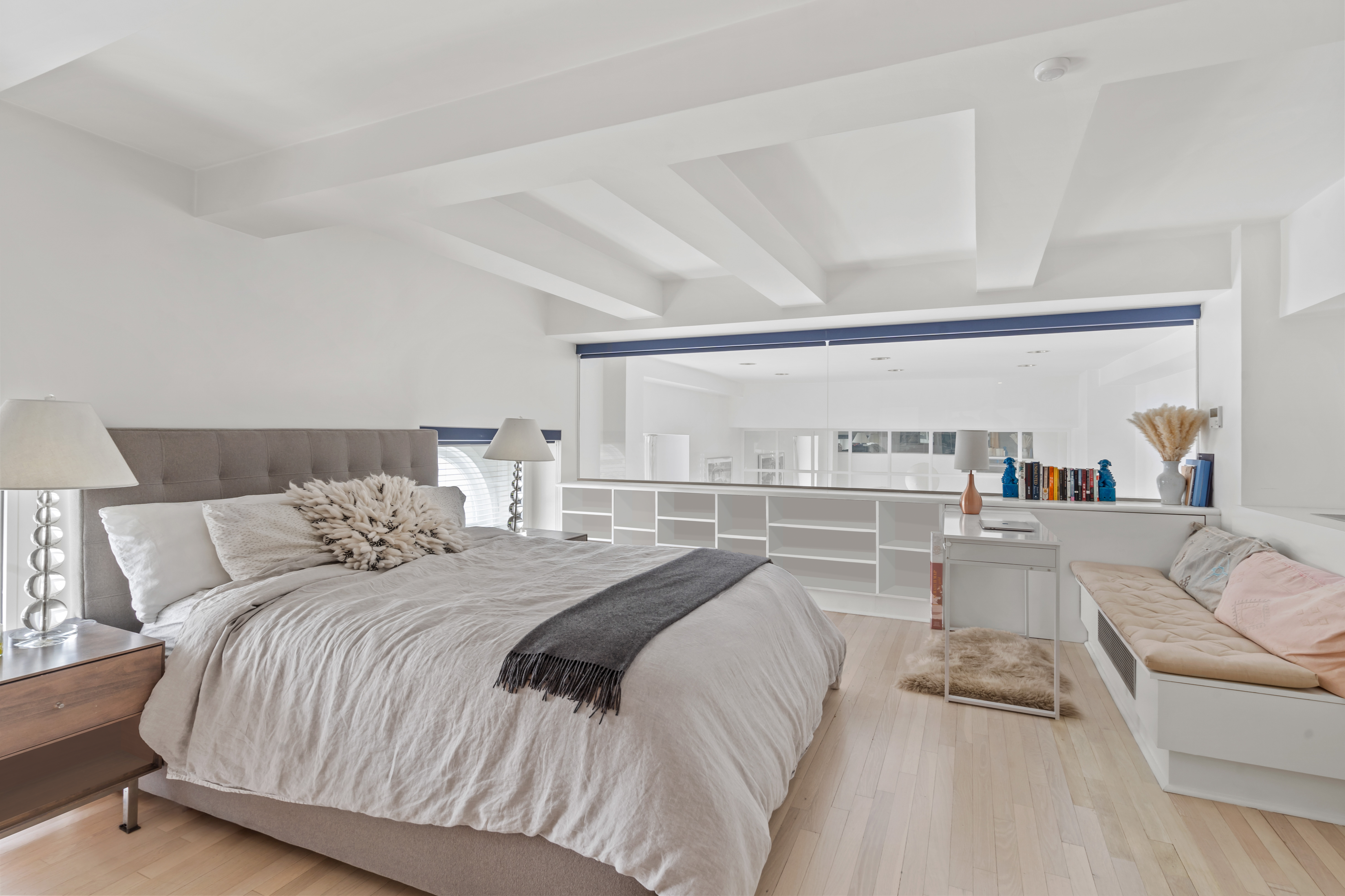 240 Centre Street, Unit 2N Manhattan, NY 10013 - Photo 9 of 16 a view of a bedroom with a large bed and a couch