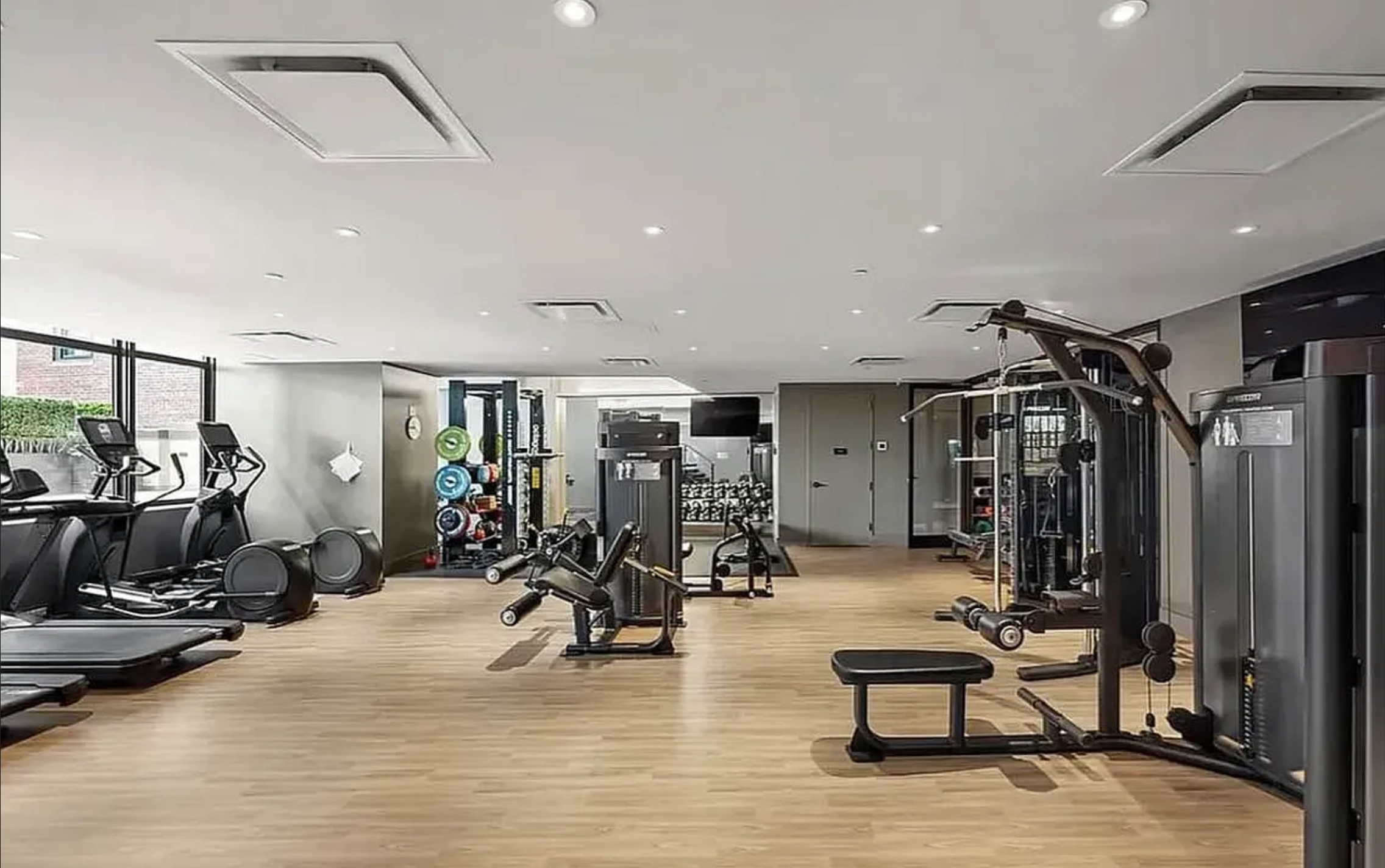 40 Broad Street, Unit 25C Manhattan, NY 10004 - Photo 9 of 10 a view of a room with gym equipment