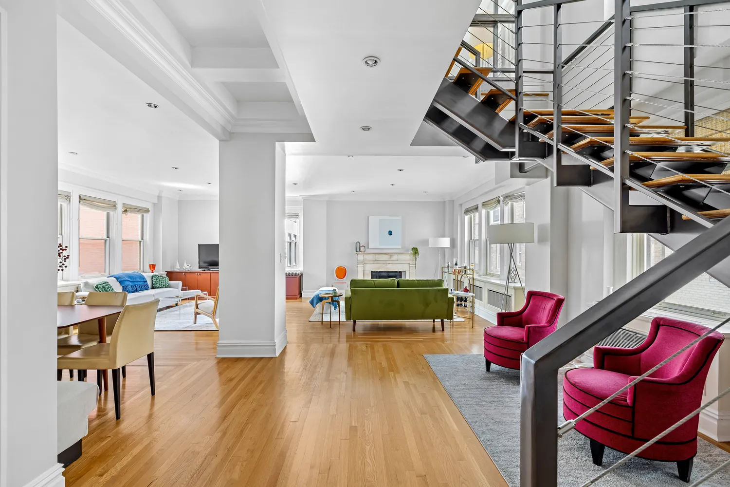 a living room with furniture or wooden floor and a chandelier