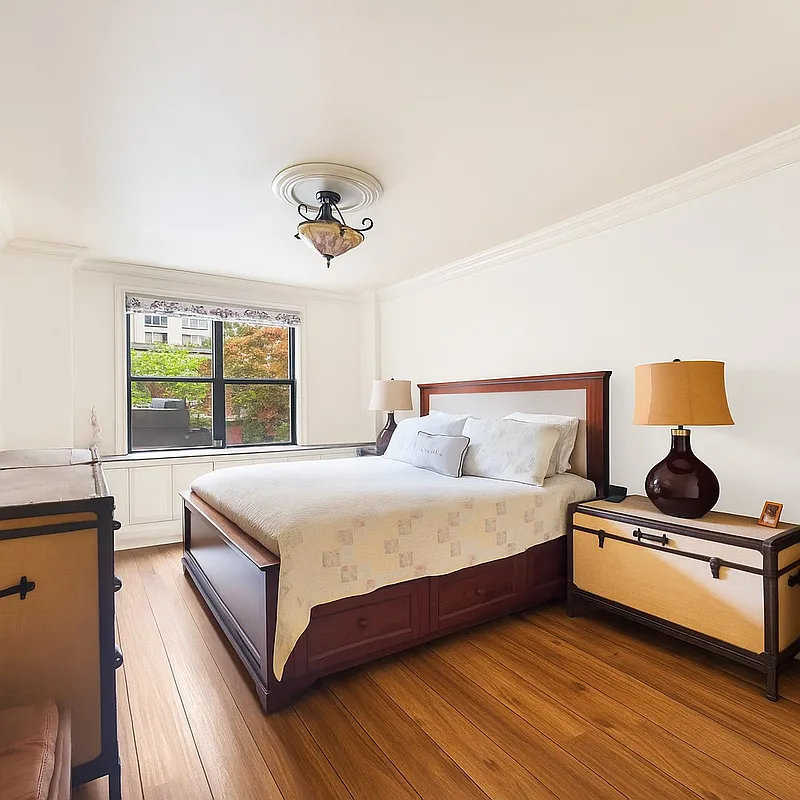 301 East 62nd Street, Unit 2K Manhattan, NY 10065 - Photo 4 of 9 a bedroom with a bed and window