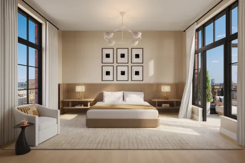 a bedroom with a large bed and a large window