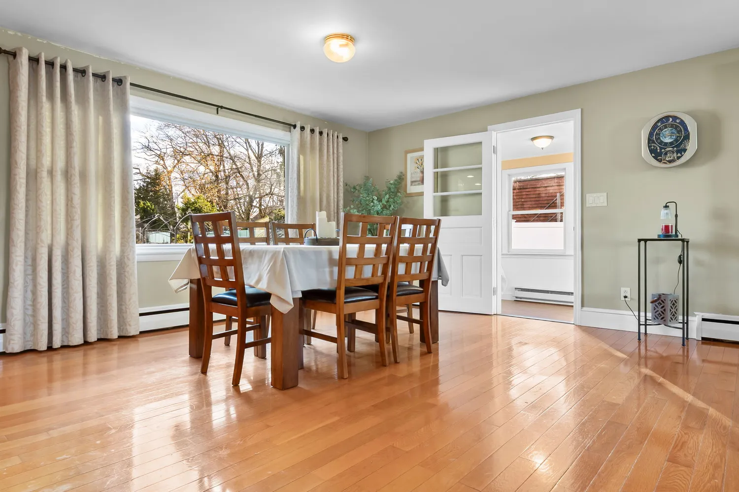 a view of a dining room with furniture window and outside view