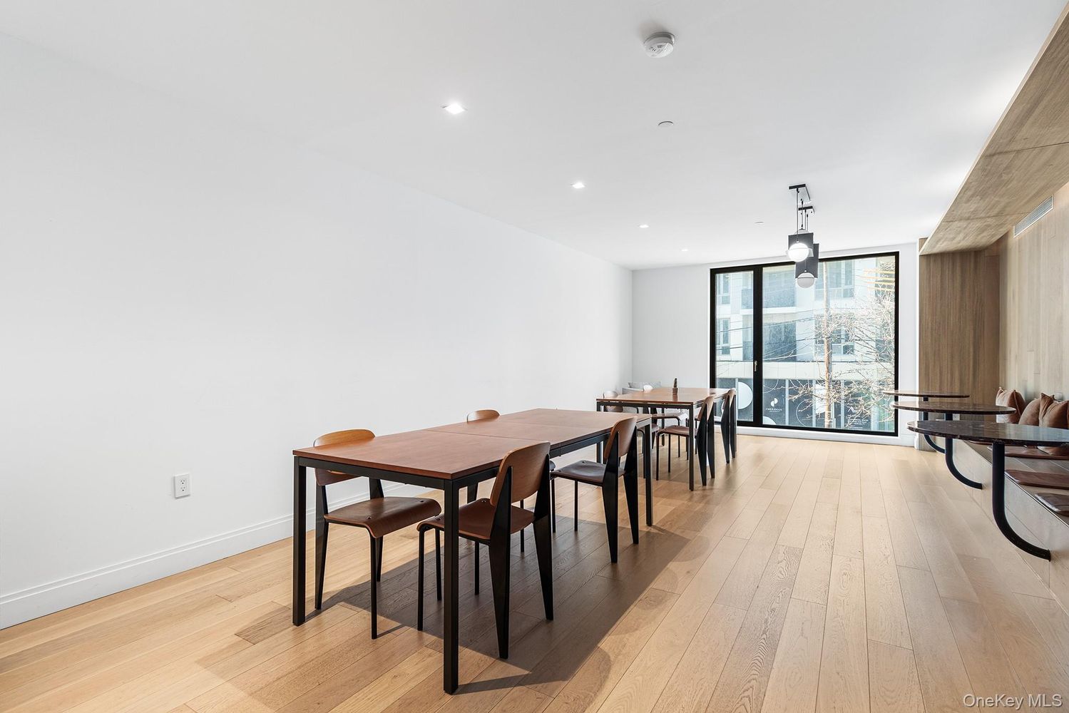 37-14 34th Street, Unit N3E Queens, NY 11101 - Photo 11 of 18 a view of a a dining room with furniture window and wooden floor