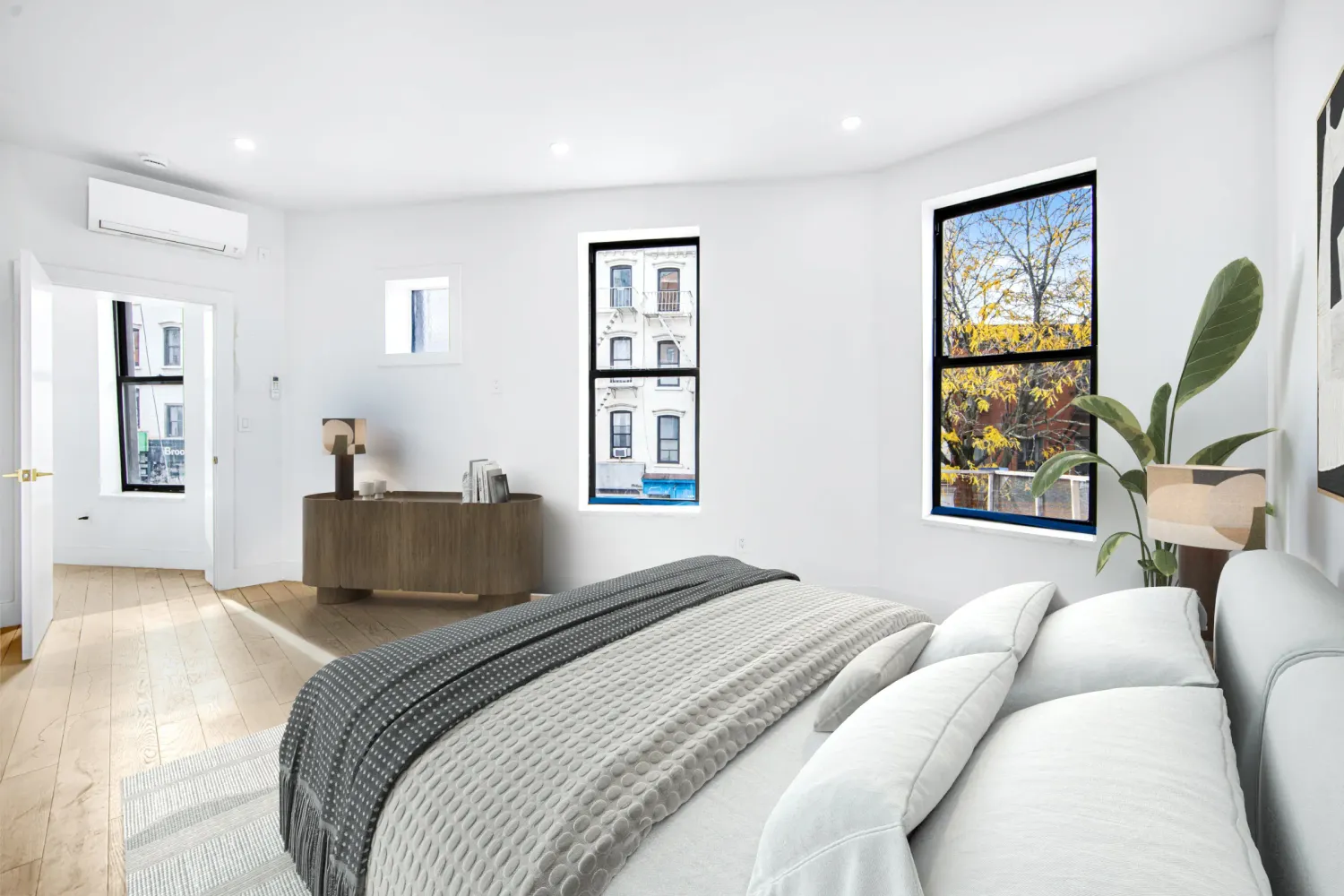 a bedroom with a large bed and a window