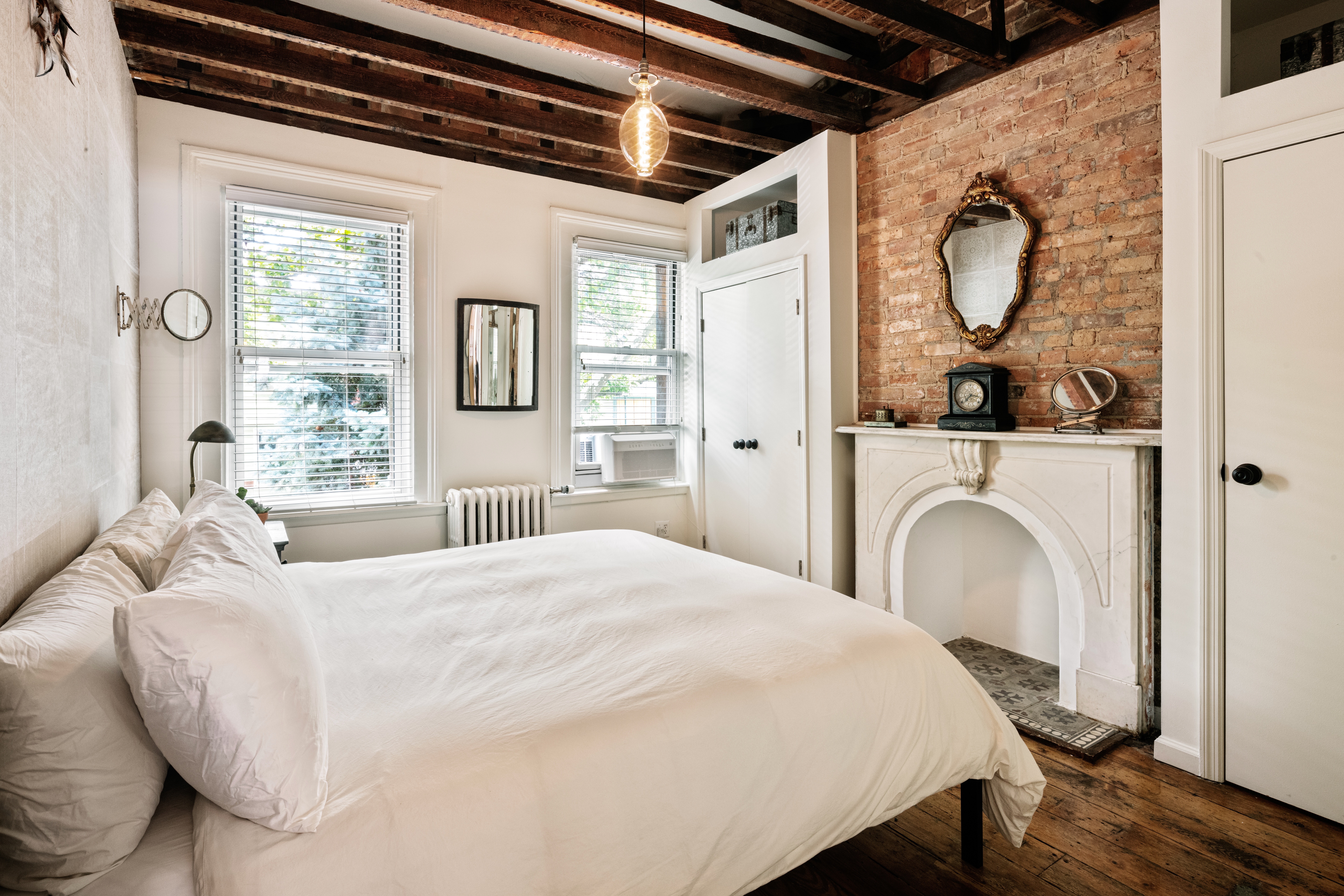 111 Powers Street Brooklyn, NY 11211 - Photo 13 of 16 a bedroom with a bed and a window